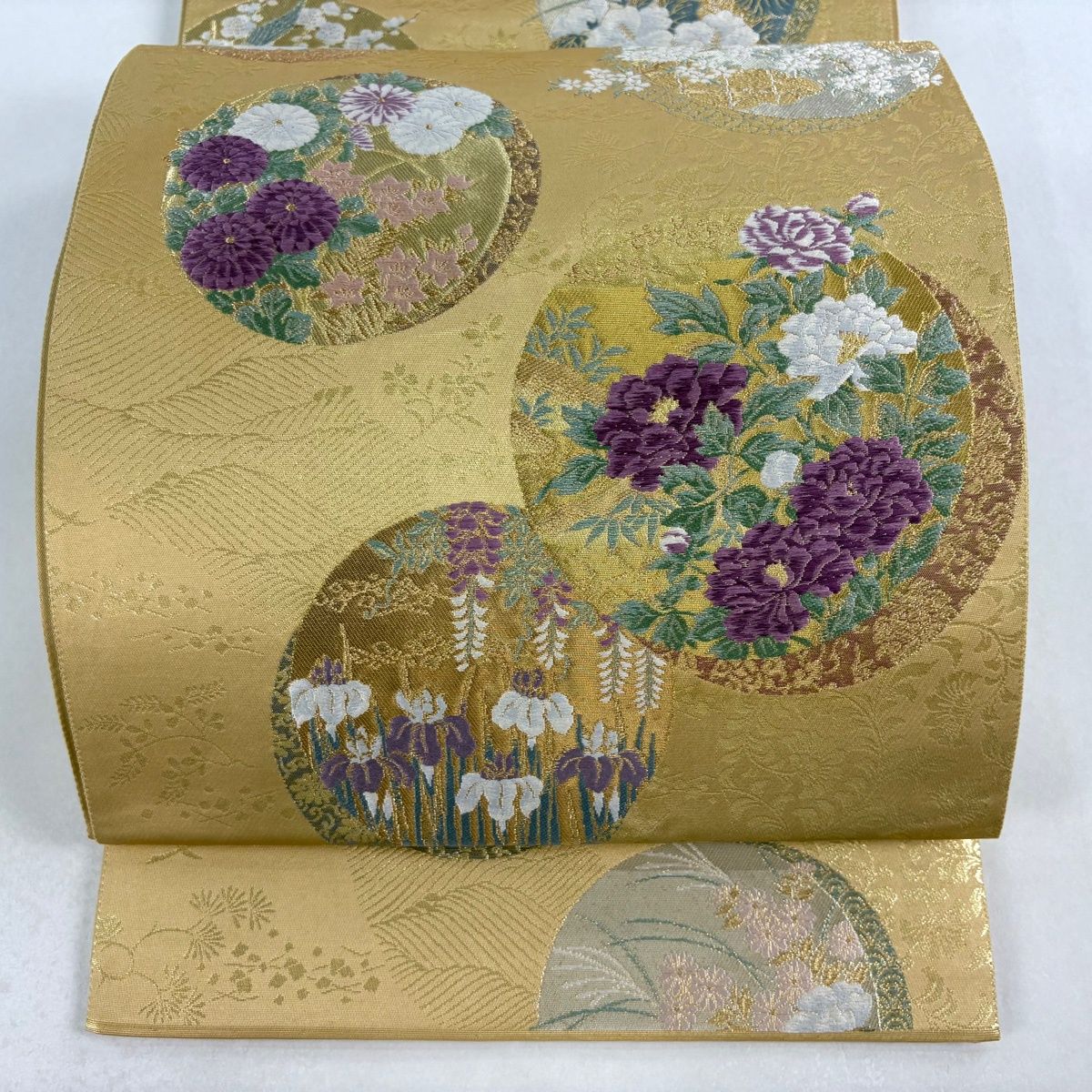 袋帯 じゅらく 落款 じゅらく帝王紫 丸文 草花 金銀糸 箔 薄黄土色 お太鼓柄 正絹