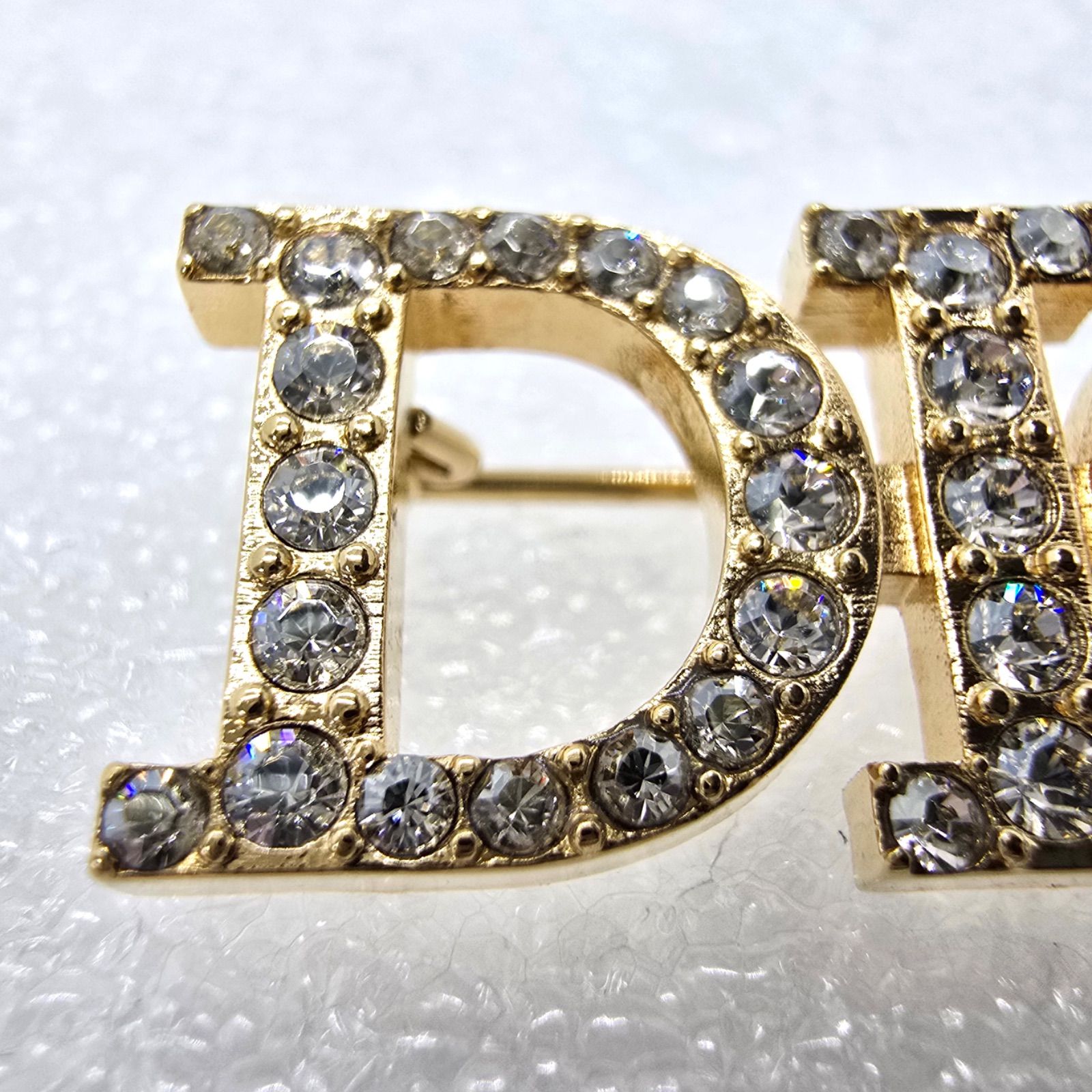 DIOR ディオール Dio(r)evolution ロゴ ブローチ クリスタル ゴールド