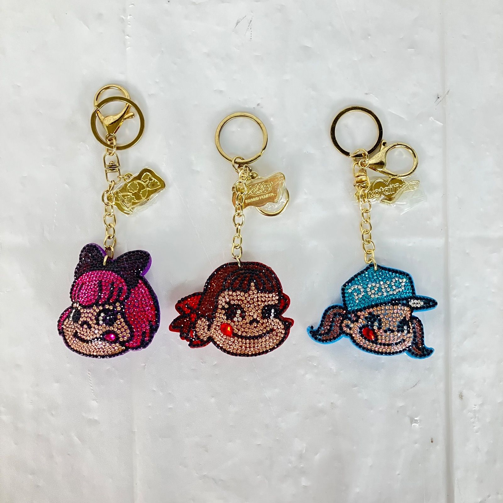 美品】キラキラキーホルダー バッグチャーム ぺこちゃん ☆ - メルカリ