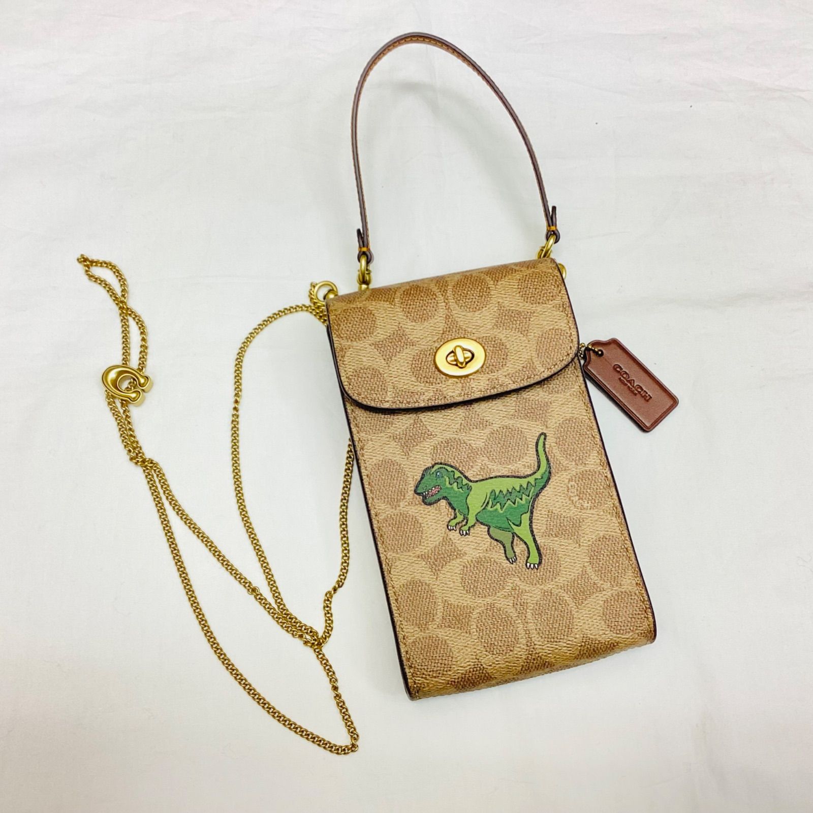COACH コーチ ターンロック フォーン クロスボディ シグネチャーキャンバス レキシ― プリント 恐竜 ティラノサウルス BROWN フォンバッグ ミニバッグ チェーンバッグ 品 定価44 000円