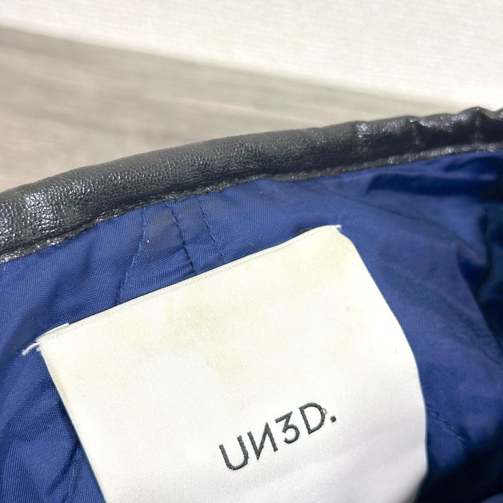 UN3D. ボアパイピングブルゾン 中綿入り 裏キルティング ノーカラー 