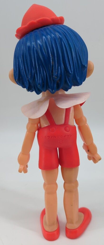 ソフトビニール製亀マークのおもちゃ 樫の木モック オレンジ服 250 mm 肌色成型