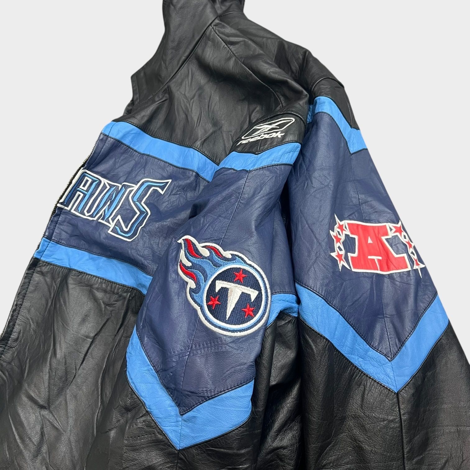 リーボック 古着 レザージャケット スタジャン REEBOK Titans