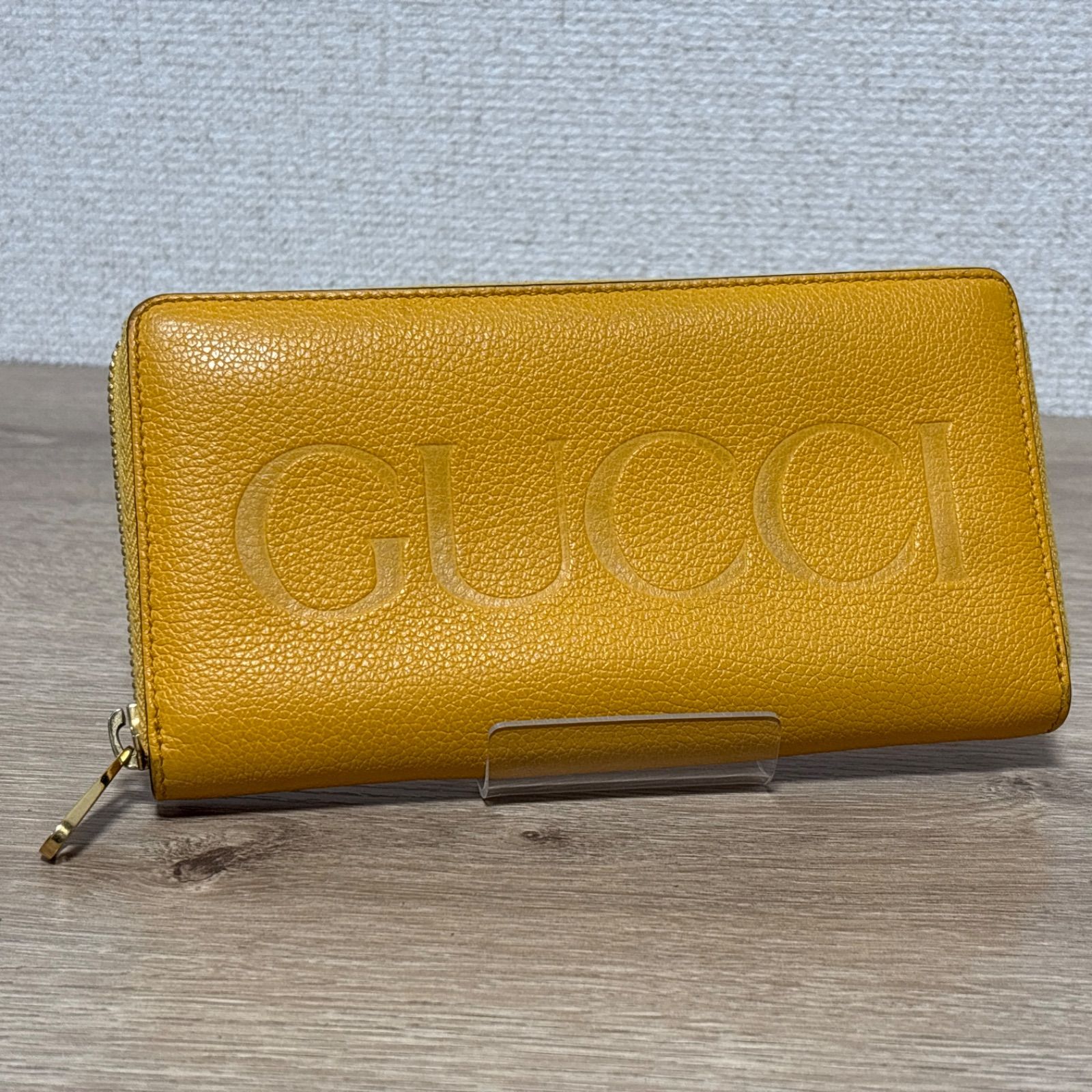 GUCCI グッチ 長財布 ラウンドファスナー ロゴ エンボス レザー