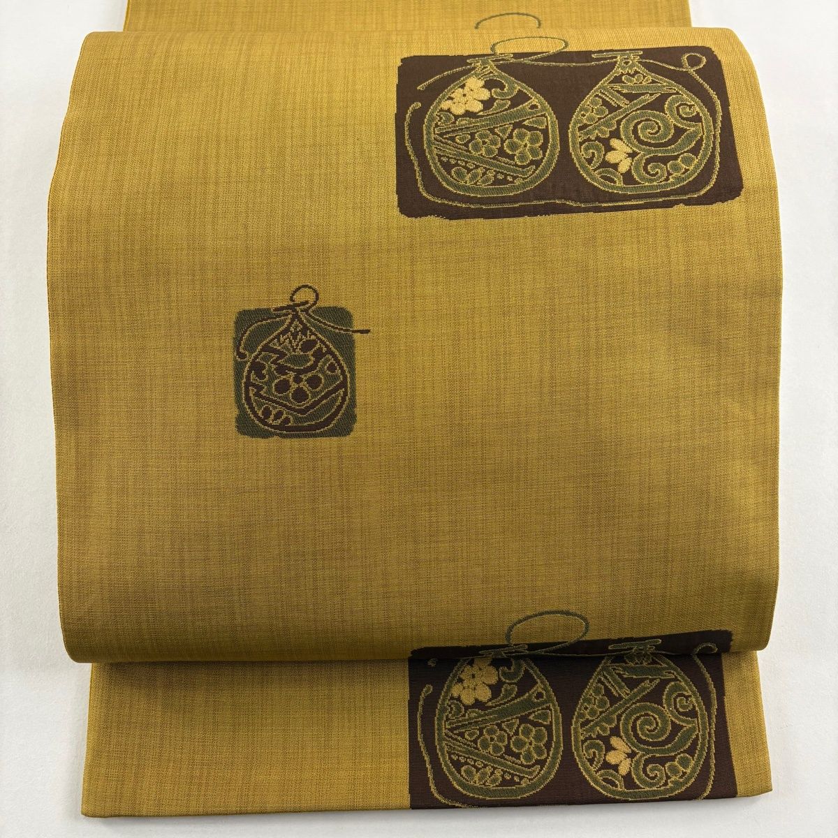 美品】 袋帯 秀品 紬地 草花 幾何学模様 黄土色 六通 正絹 【中古