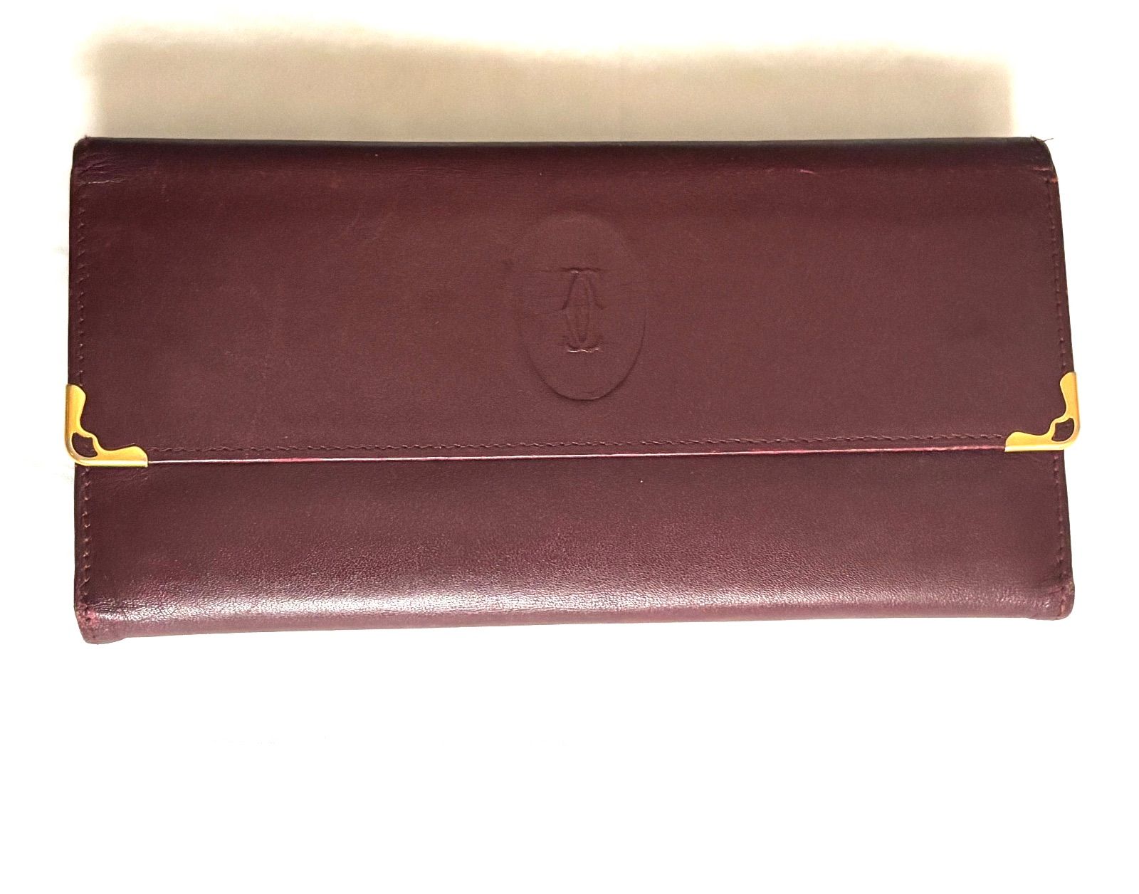 カルティエ 三つ折り財布 がま口 マストライン 本革 ボルドーゴールド金具 カルティエ Cartier マストライン 財布 三つ折り がま口 レザー ロゴ