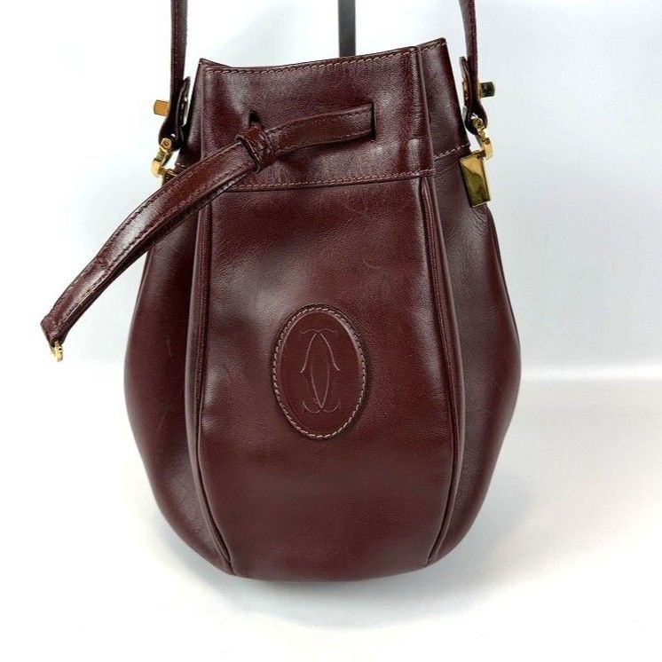 【良品】カルティエ マストライン 巾着ショルダーバッグ 小さめ レザー ボルドー 良品 Cartier カルティエ 巾着 ショルダーバッグ マストライン レザー