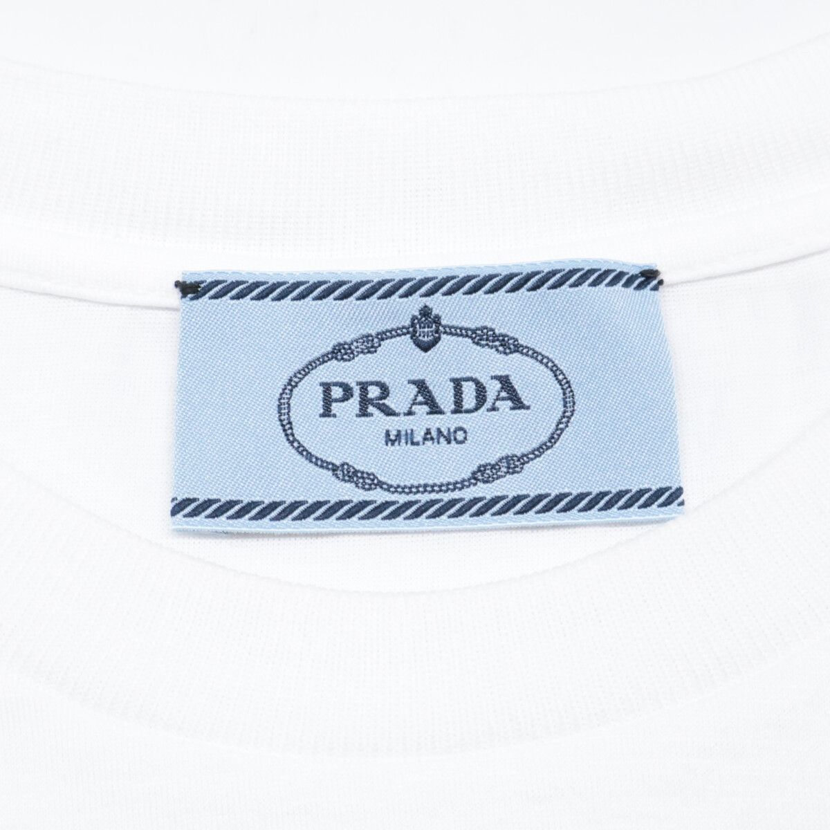 PRADA プラダ 35838 20年 ﾎﾜｲﾄ ﾗﾊﾞｰﾄﾗｲｱﾝｸﾞﾙﾛｺﾞ Tｼｬﾂ【自社