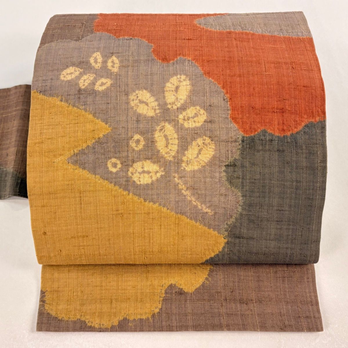 名古屋帯 秀品 紬地 葉柄 雪輪 絞り 茶色 正絹