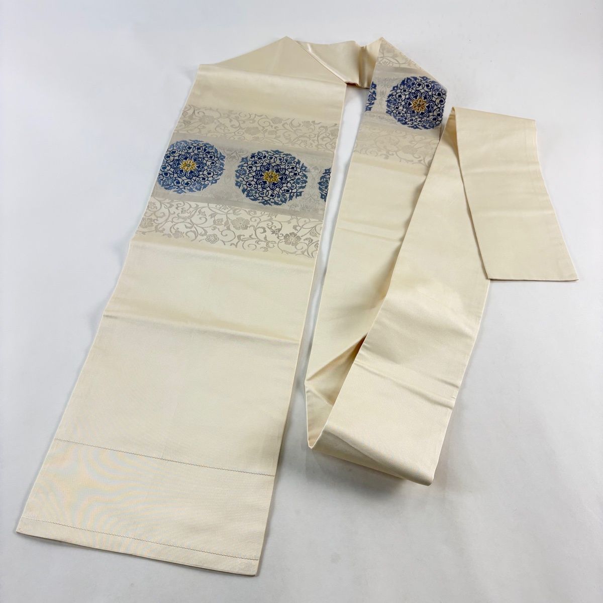 名古屋帯 秀品 関西仕立て 華文 花唐草 金糸 箔 クリーム 正絹 【中古