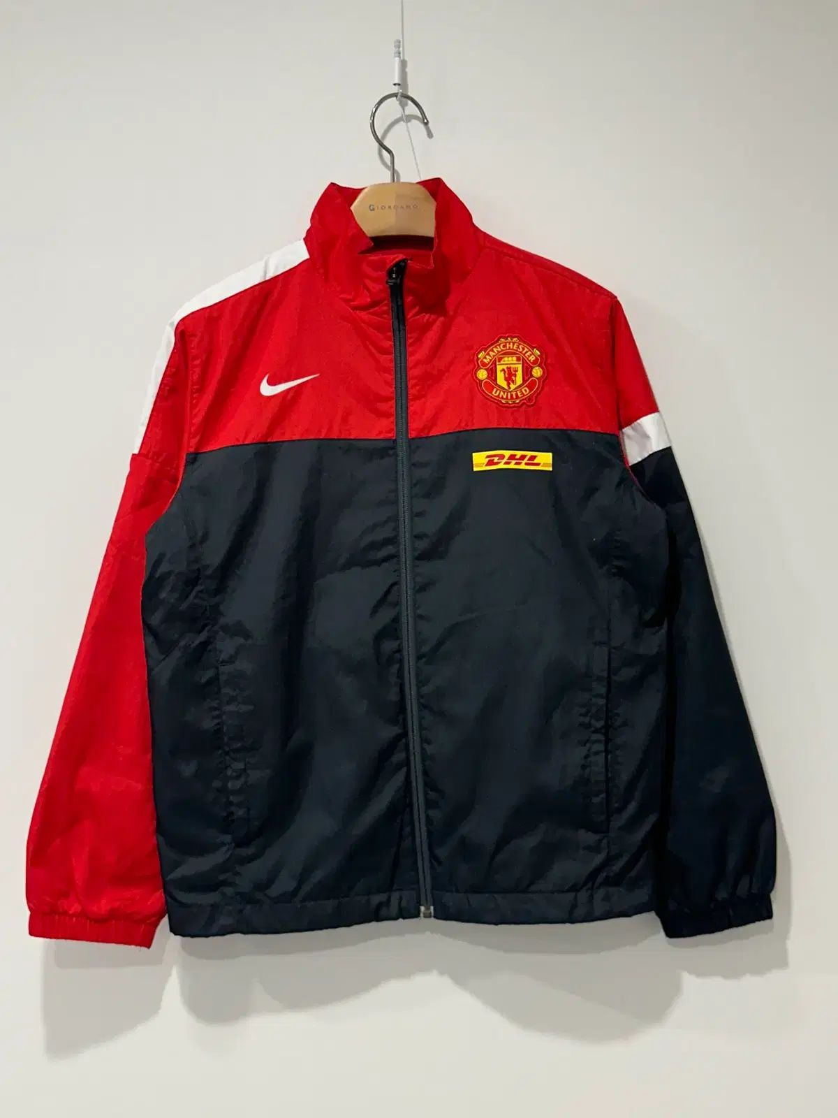 Nike Manchester United ウィンドブレーカー Nike マンチェスター・ユナイテッド ウィンドブレーカー オレンジ