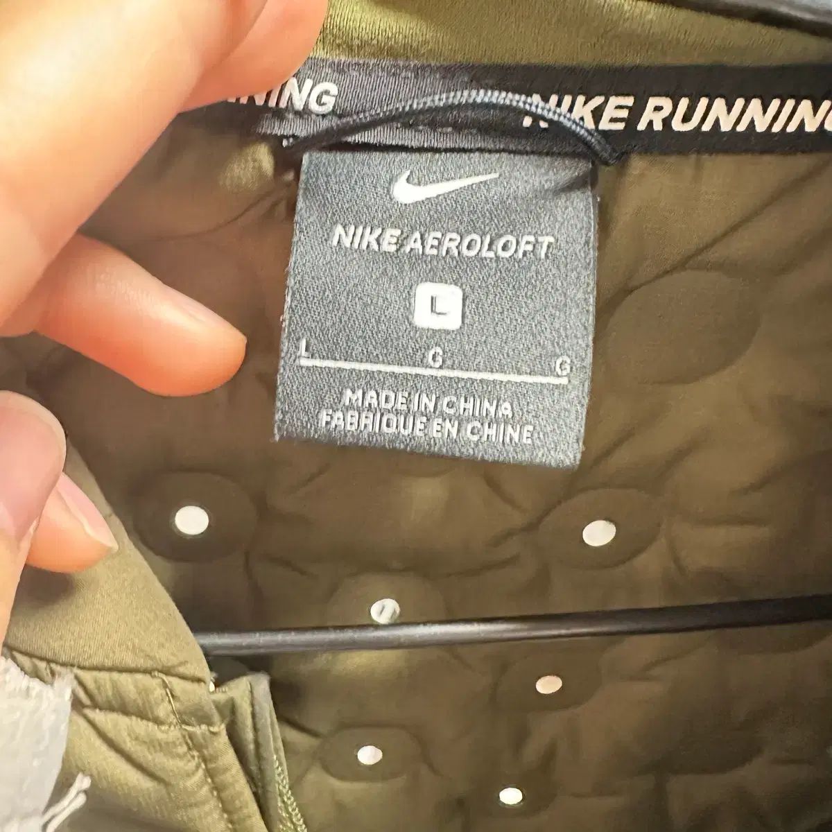 ナイキ ランニング ダウンベスト エアロロフト - メルカリ