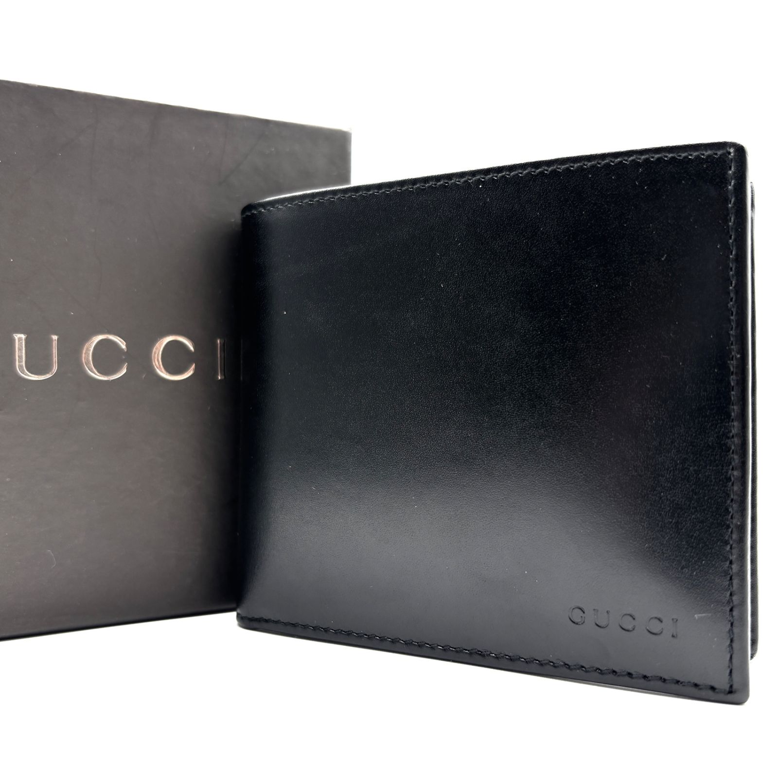 ♥保管品 き GUCCI グッチ 二つ折り財布 札入れ ロゴ型押し カーフレザー 本革 メンズ ブラック ビジネス フォーマル シンプル 無地
