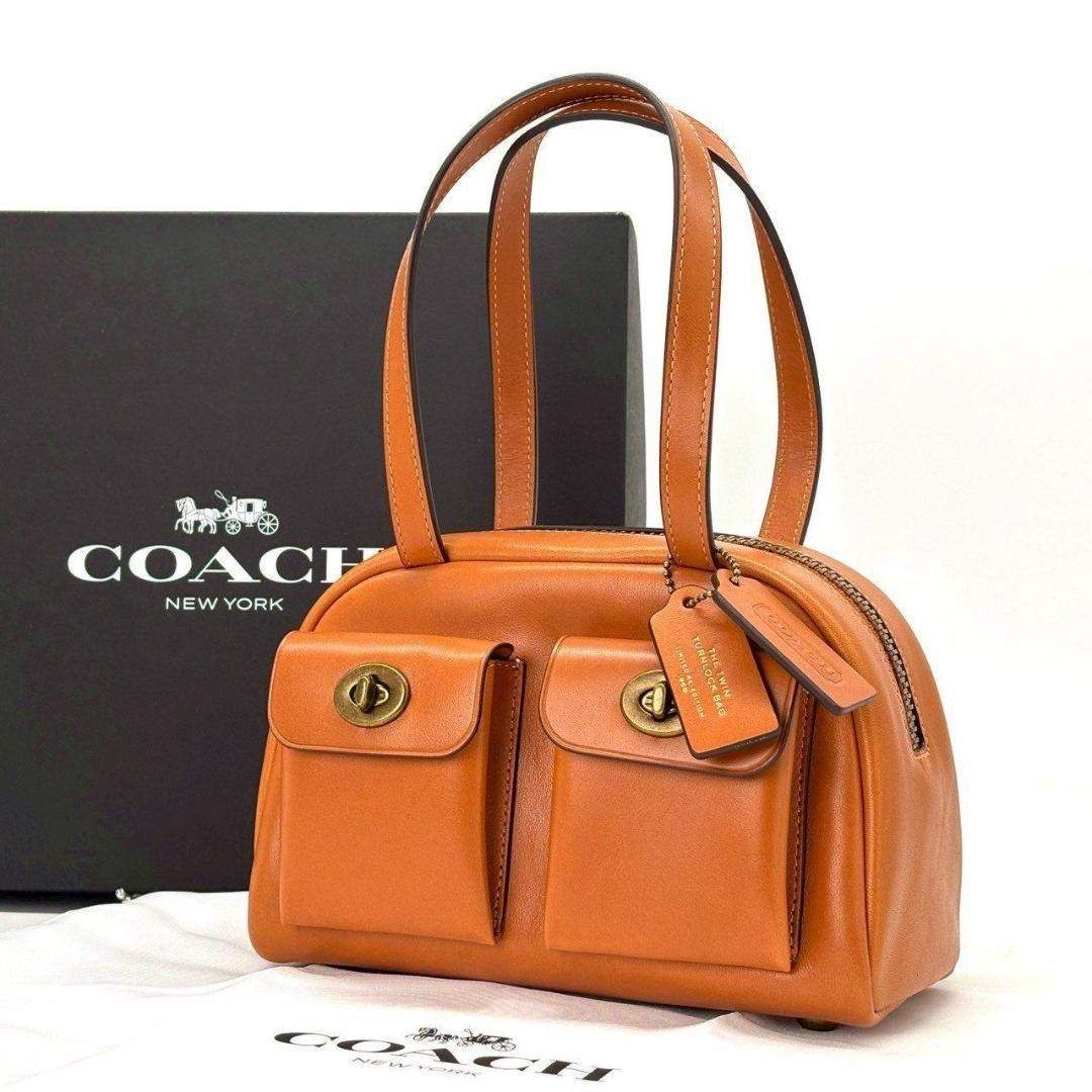 頑張った日に、選びたい】 COACH ハンドバッグ ツインターンロック 