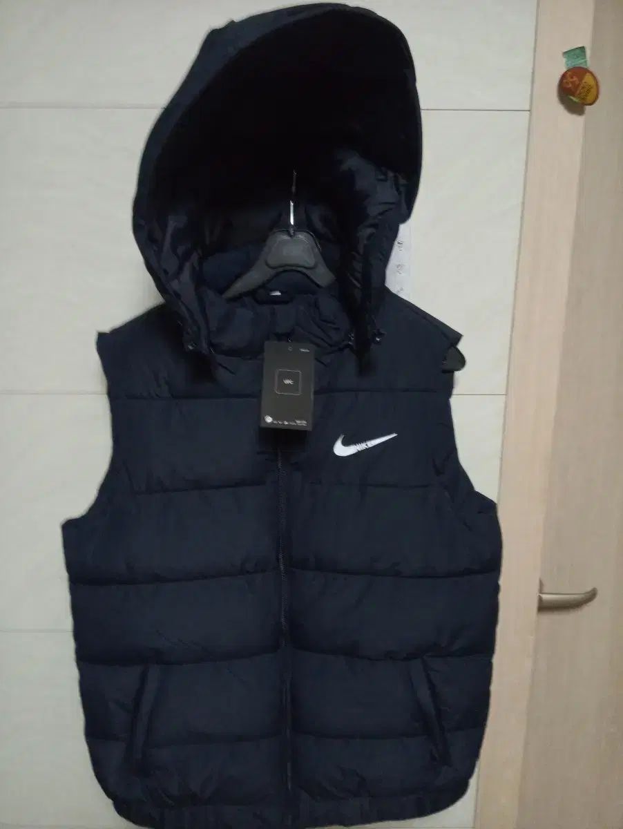 ナイキ フード ダウン ベスト デニムカラー