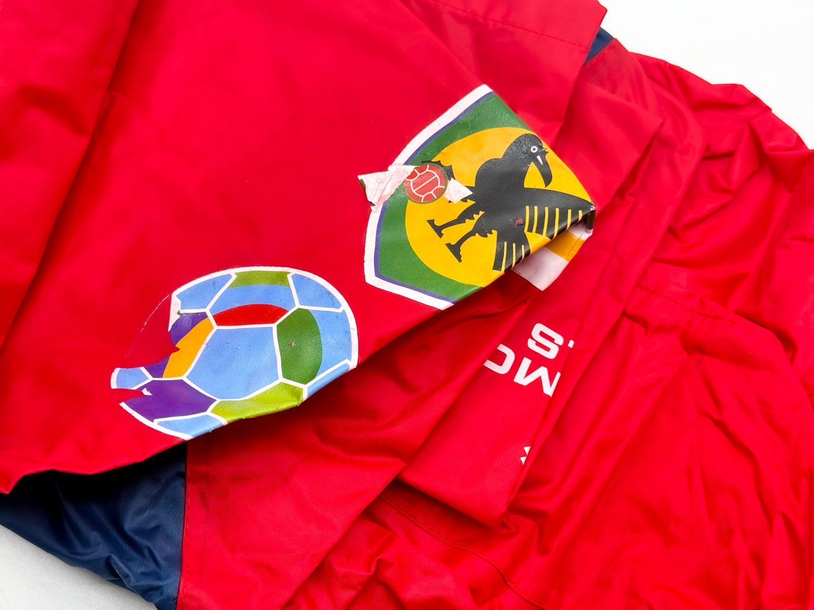 ①鹿島アントラーズ 公式 ポンチョ レインウェア 赤 ネイビー SOCIO