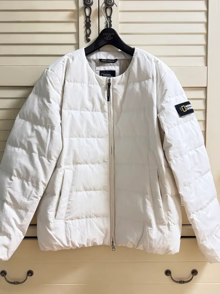ナショナルジオグラフィック ヘロン Uネック 軽量アウター IVORY 95
