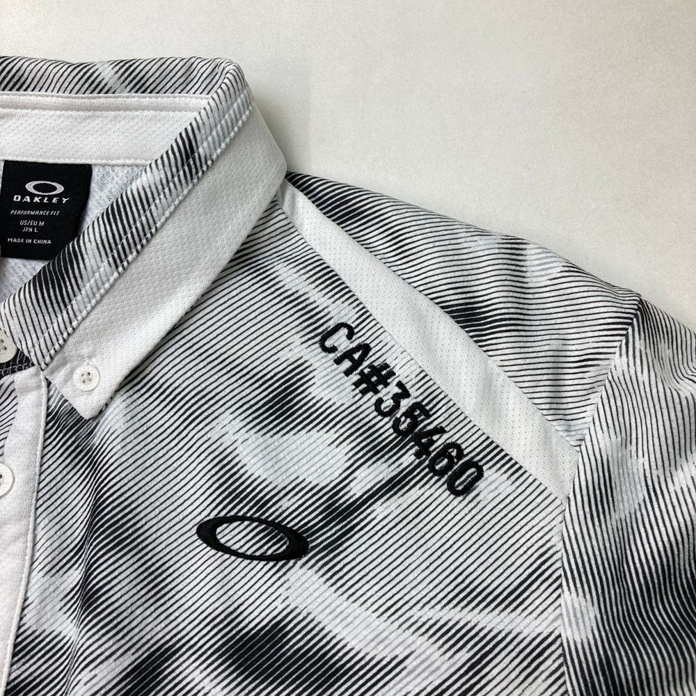サイズ：L OAKLEY オークリー 2024年 半袖ポロシャツ 総柄 ホワイト系