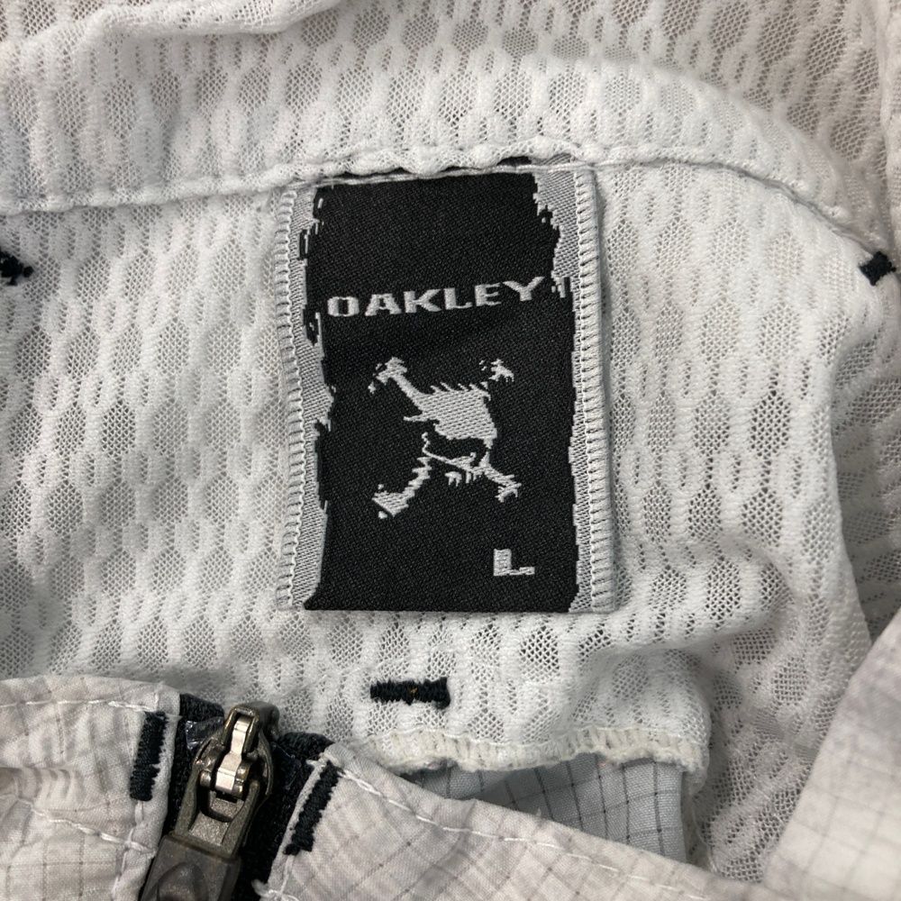 サイズ：L OAKLEY オークリー フード付 ジップベスト スカル刺繍×総柄
