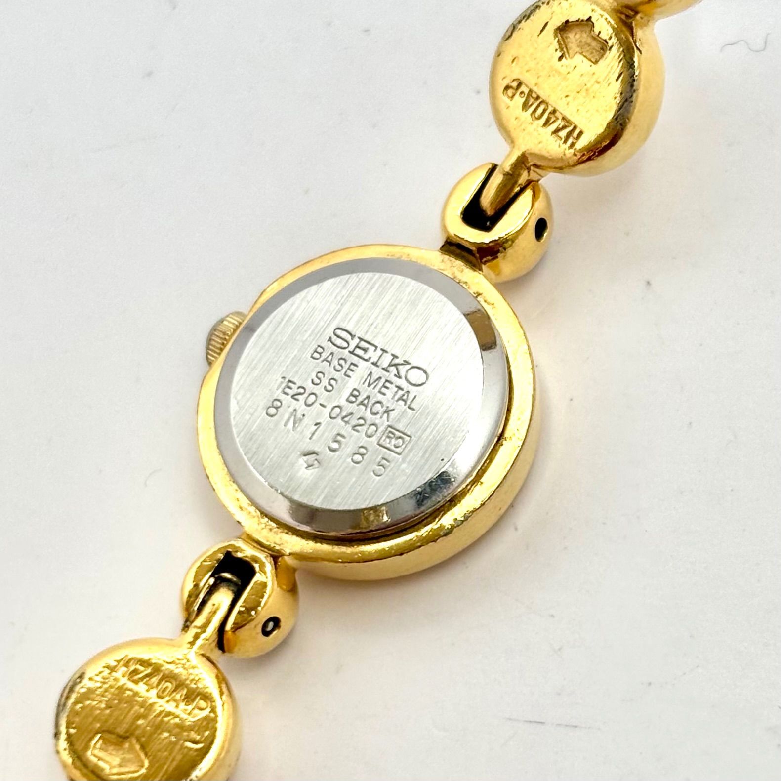 SEIKO セイコー 1E20-0420 ゴールドカラー クオーツ 腕時計 s-l400.jpg