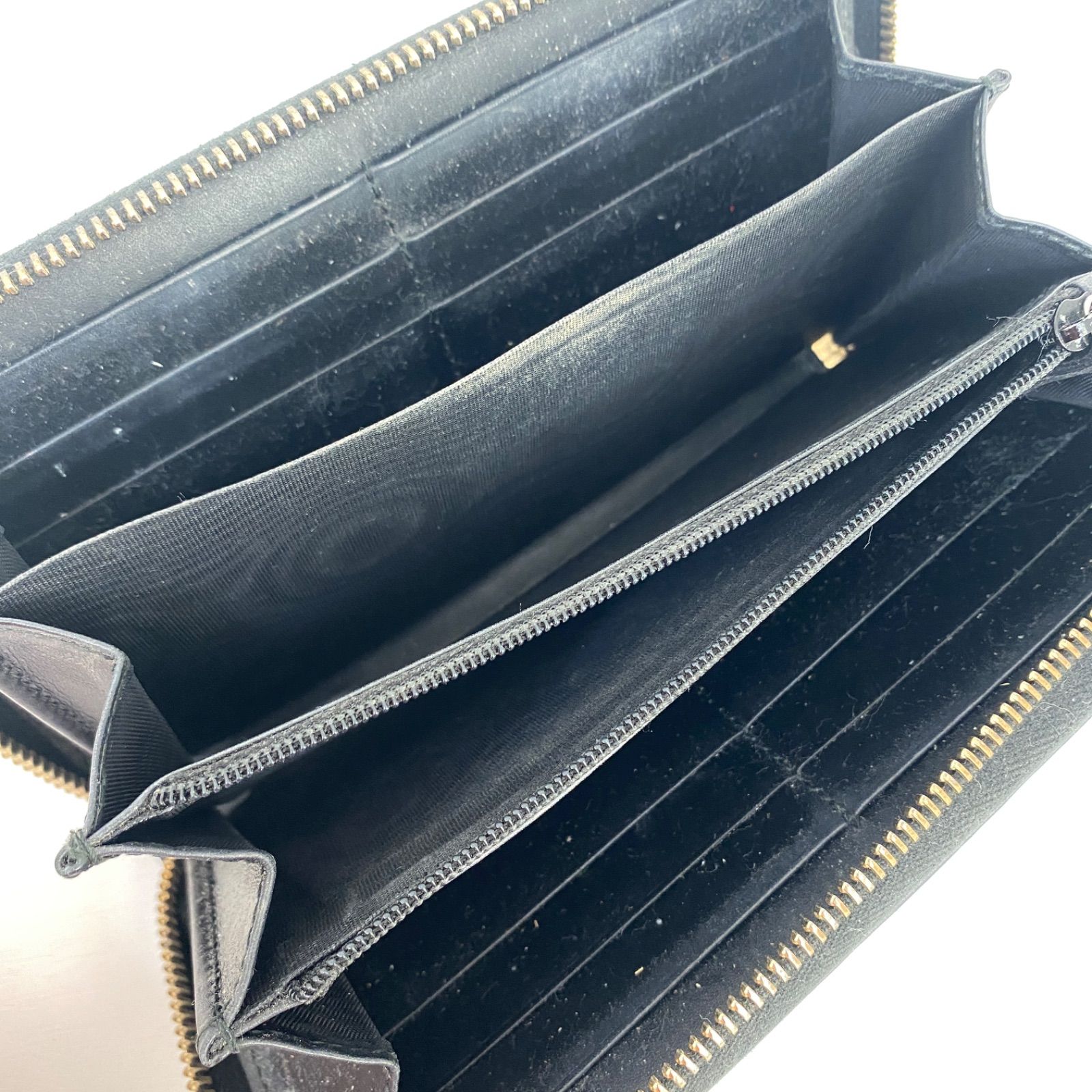 GUCCI GGエンボス インターロッキング リボン金具 ラウンド 長財布