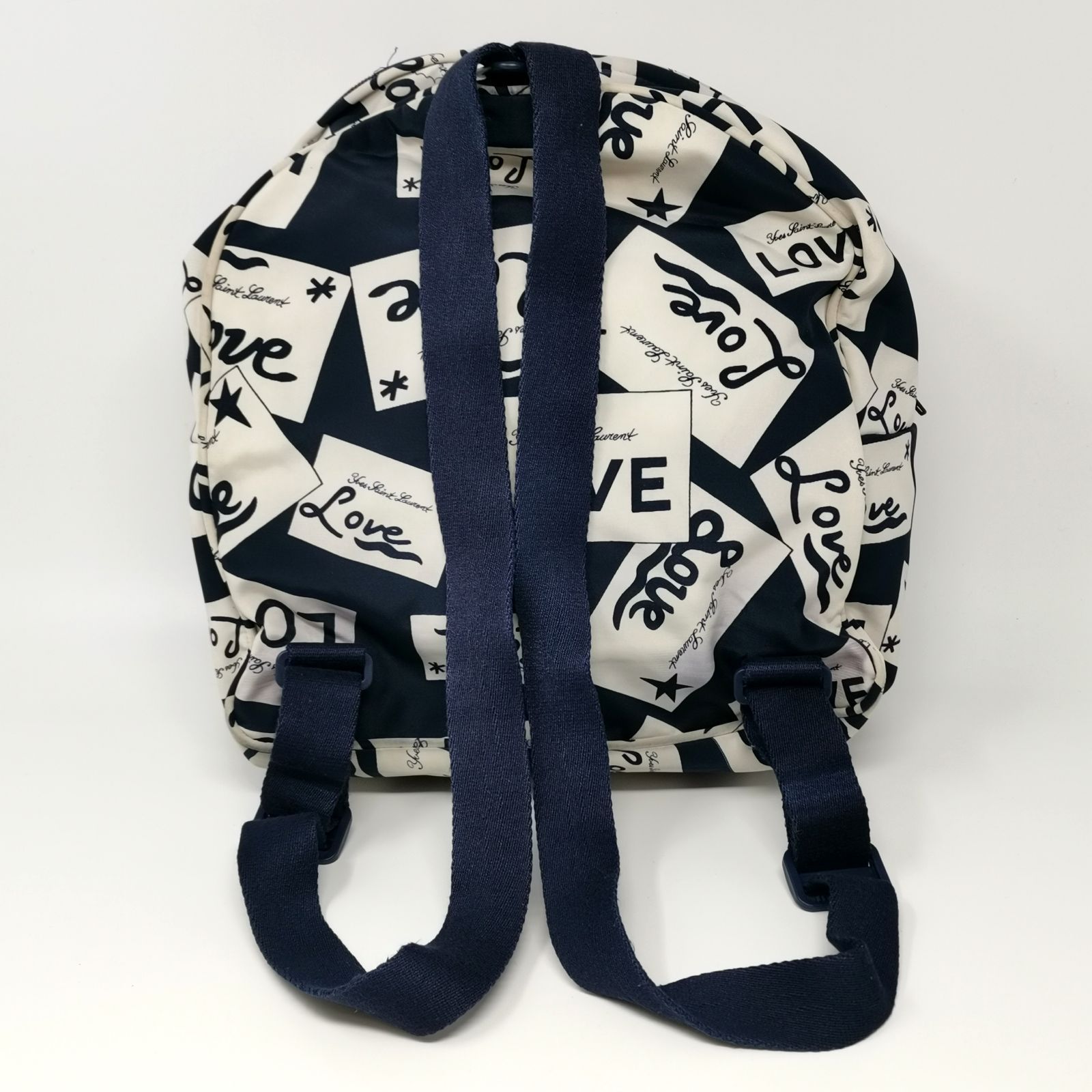 美品■イヴサンローラン　リュック　YSL　総柄　エンボス　チャーム　レザー　濃紺 美品□イヴサンローラン リュック YSL 総柄 エンボス チャーム レザー