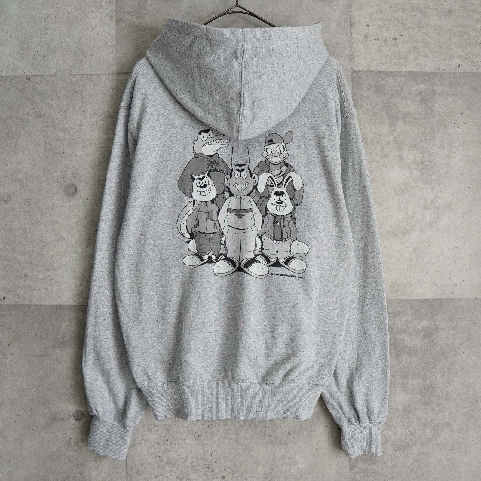 ディスイズネバーザット プリント パーカー グレー - メルカリ