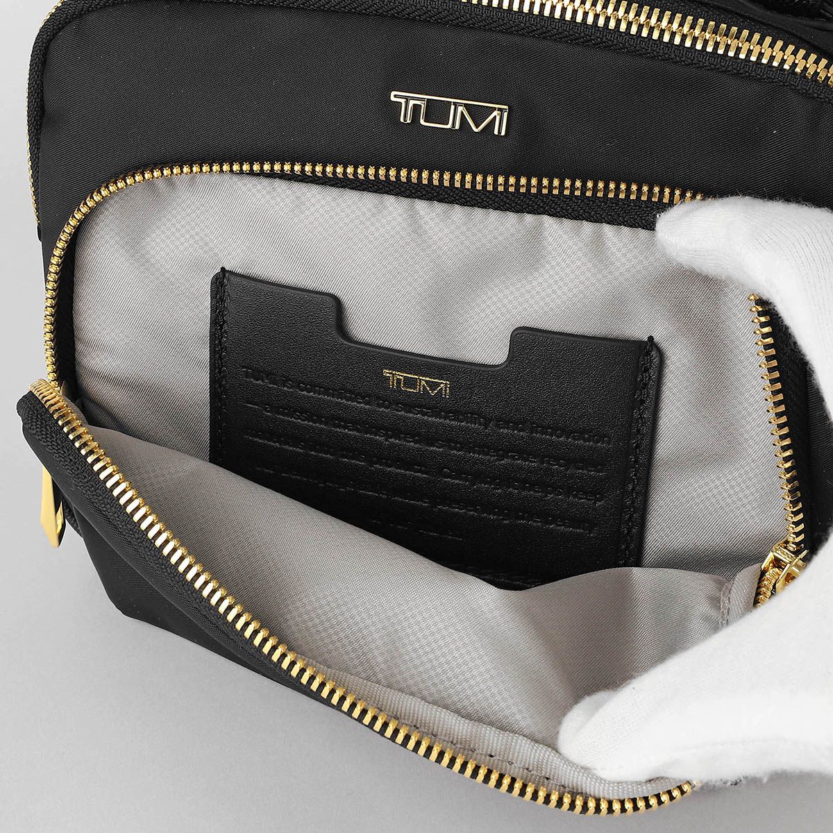 新品 トゥミ TUMI ショルダーバッグ ヴォヤジュール ブラック/ゴールド 