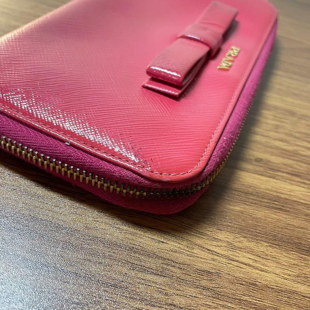 美品】PRADA サフィアーノ リボン 長財布 ピンク 正規品 - メルカリ