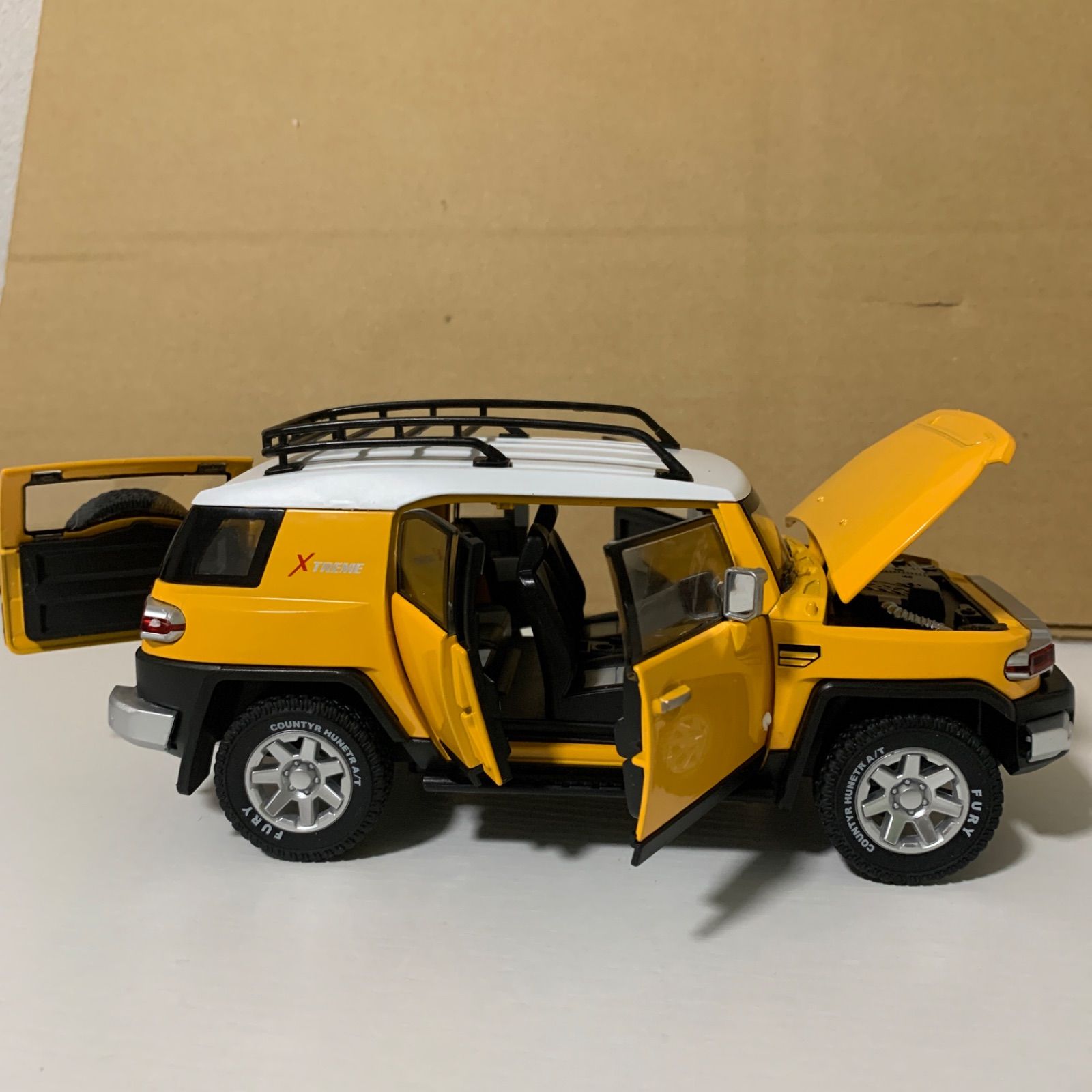 トヨタ FJクルーザー ダイキャスト 1/24 ミニカー 黄色 - メルカリ