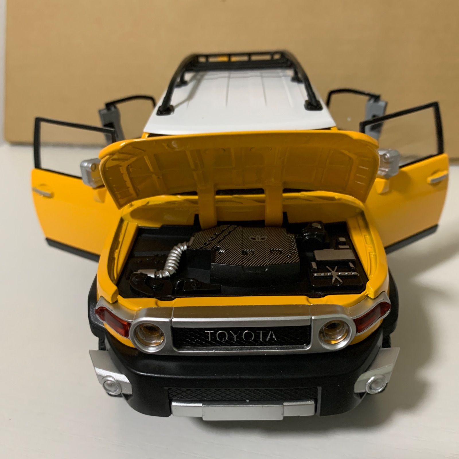 トヨタ FJクルーザー ダイキャスト 1/24 ミニカー 黄色 - メルカリ