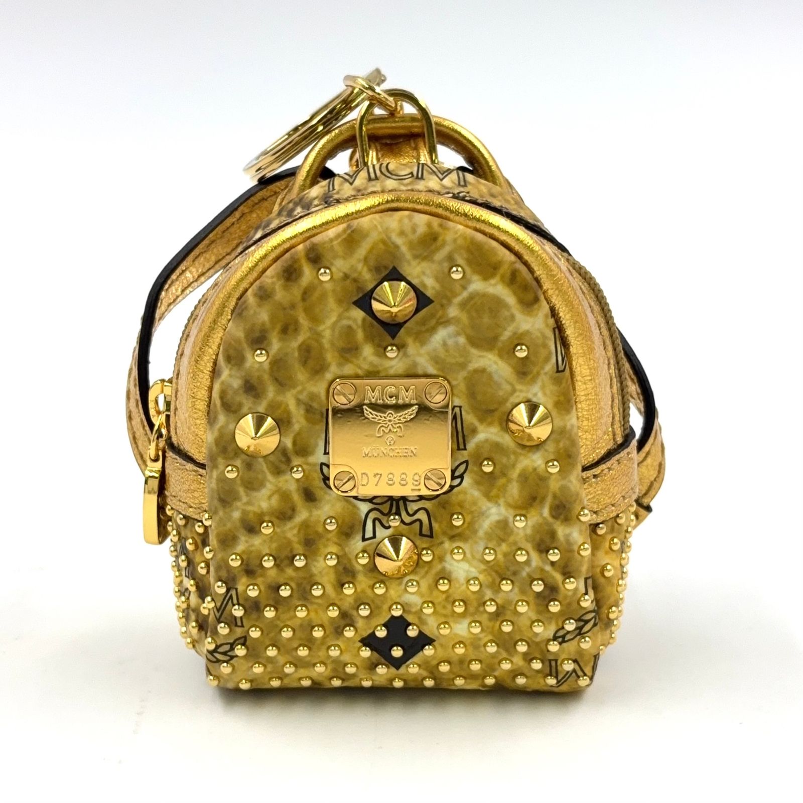 MCM ボディバッグ ゴールド MCM バックパック型 ミニポーチ PVC ゴールド チャーム ゴールド