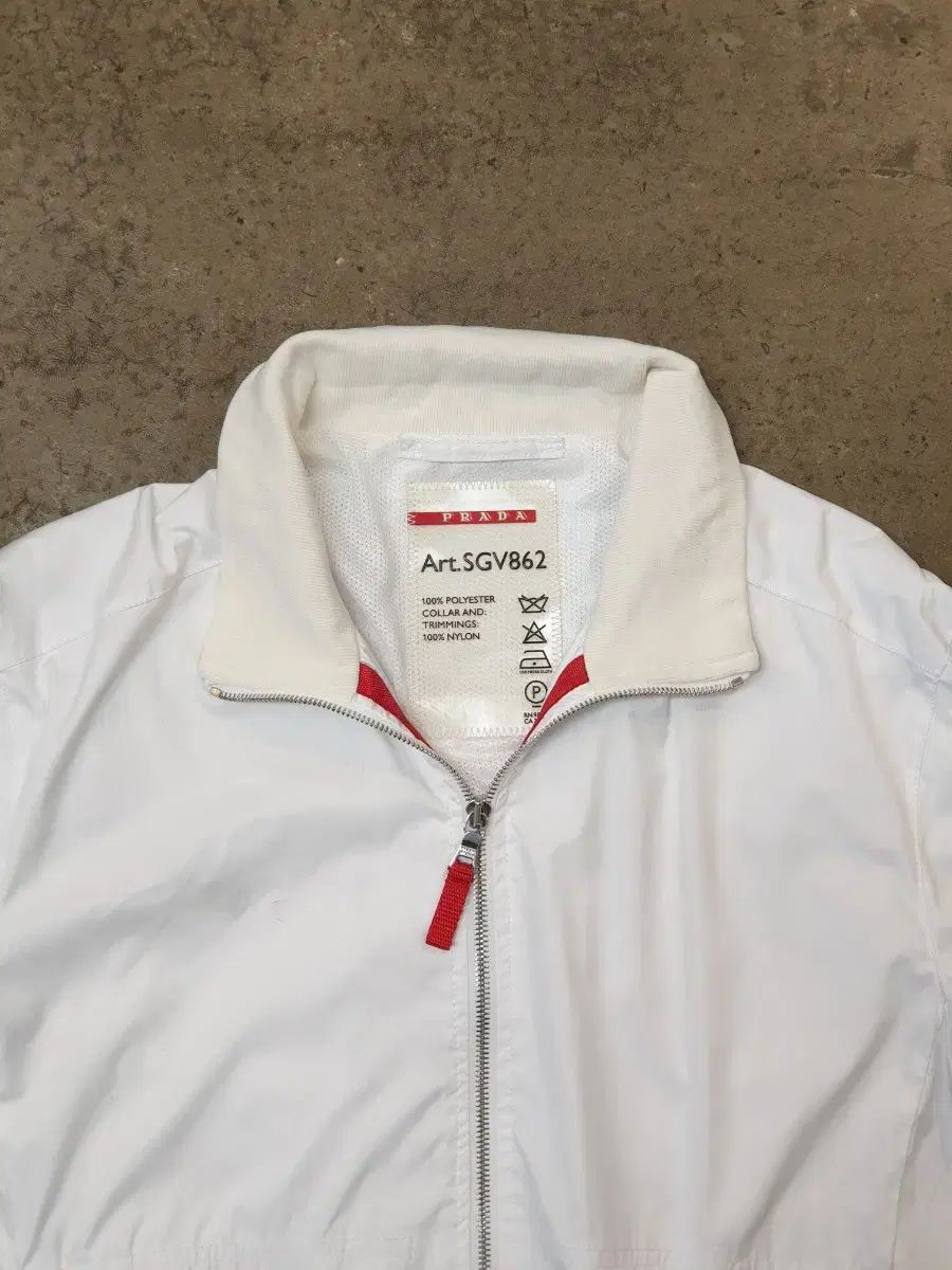 PRADA プラダ　ホワイトシングルライダースジャケット PRADA プラダ 白 ウィンドブレーカー ジャケット Art SGV862 - メルカリ