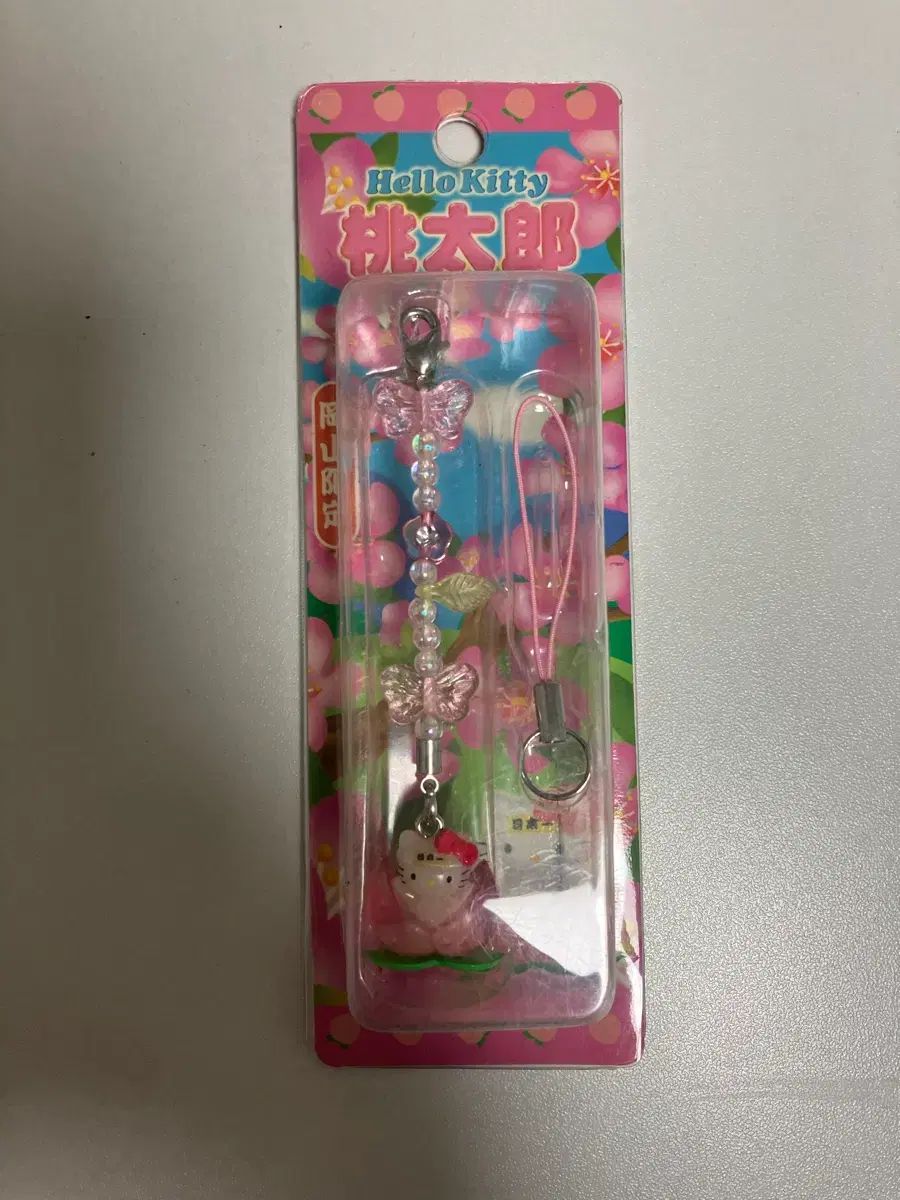 未開封新品) 桃 ハローキティ ストラップ - メルカリ