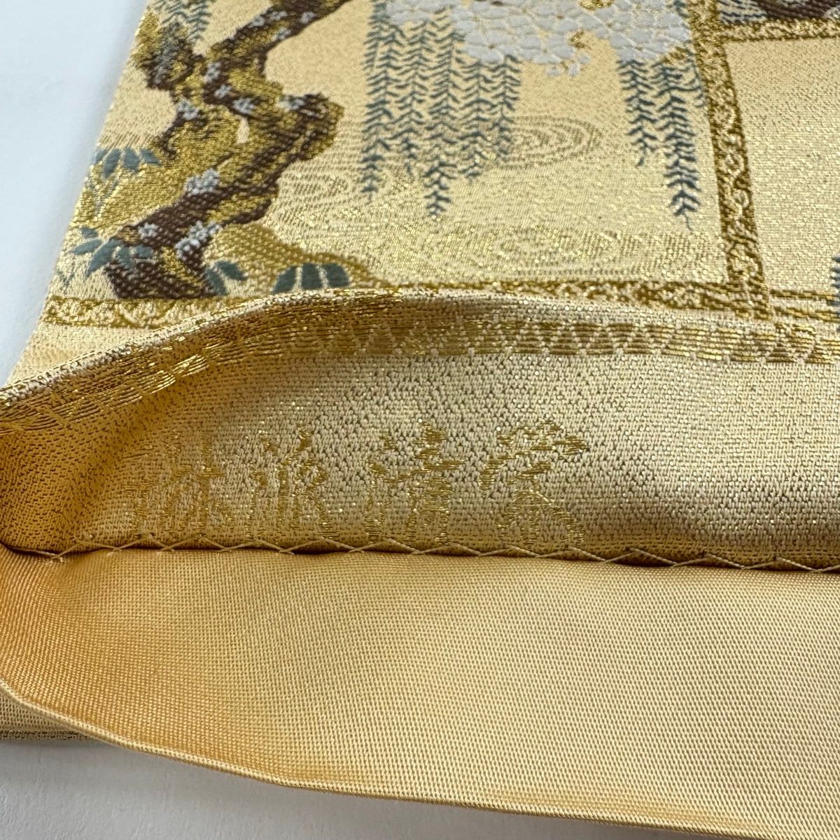 金色地色。金糸で松のお柄刺繍です。上品で趣きありますとても綺麗なお品の袋帯です。 美品】 袋帯 逸品 じゅらく 落款 帝王紫 菊 松梅 金糸 箔 金色 六通
