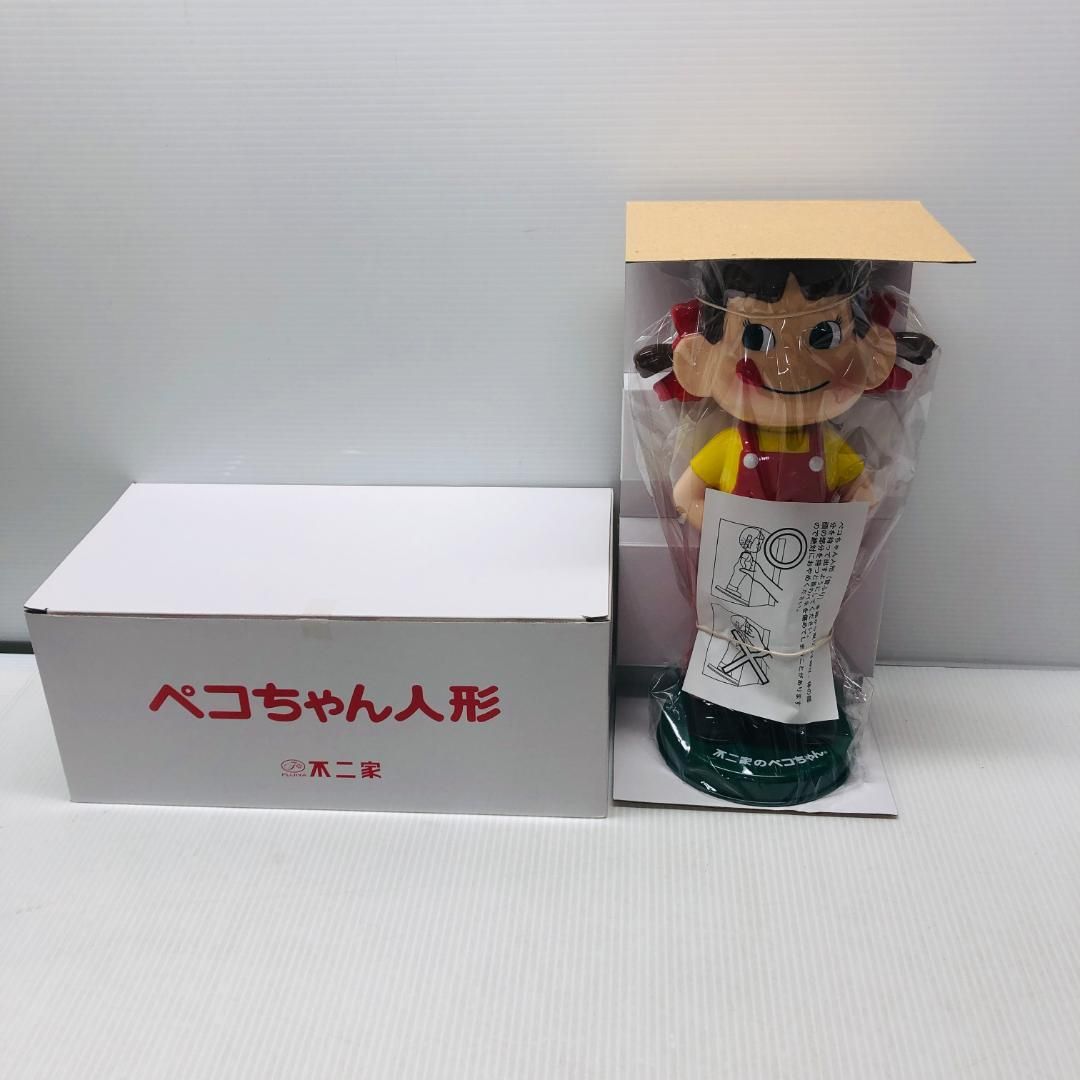 開封未使用品】 ペコちゃん 首振り人形 - メルカリ