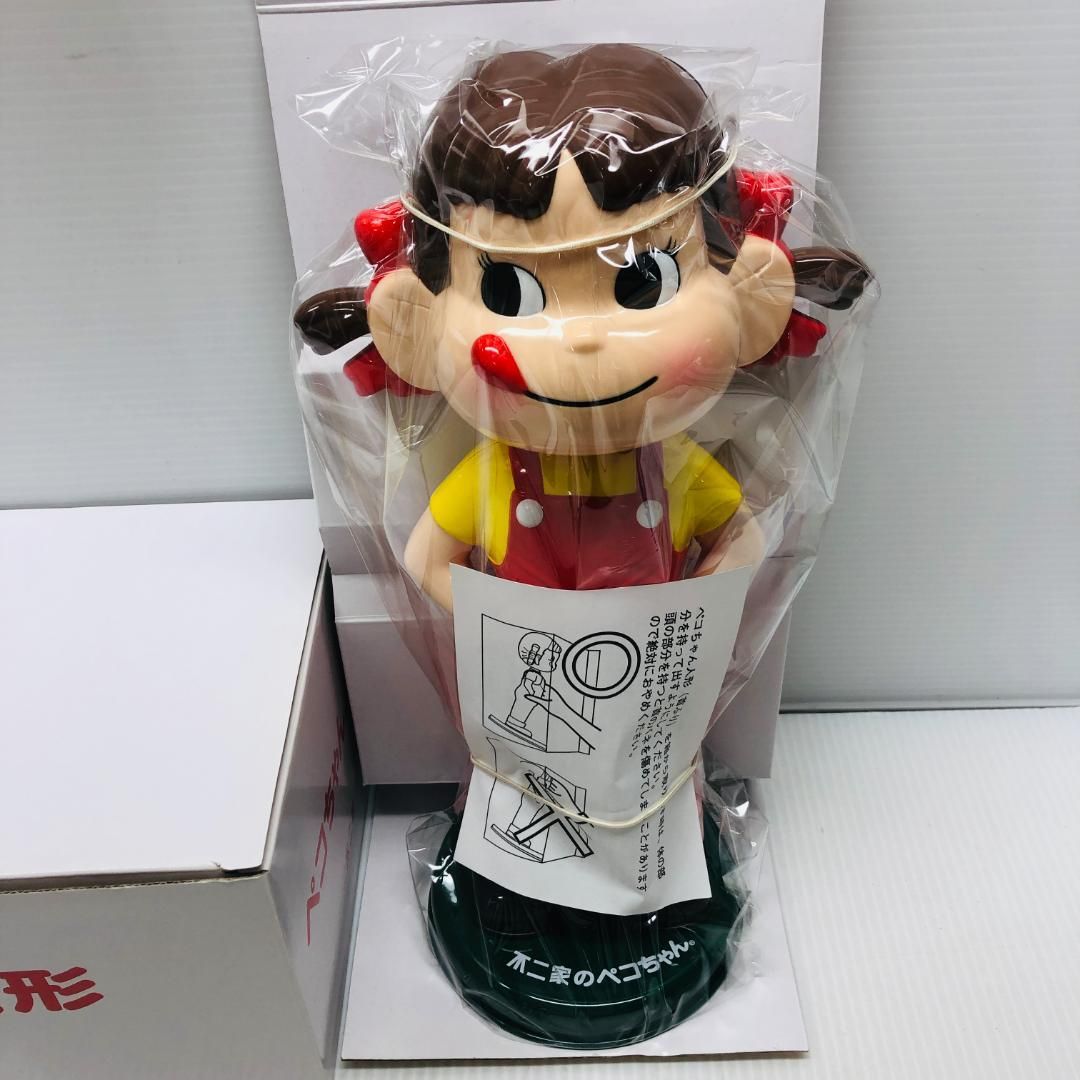 開封未使用品】 ペコちゃん 首振り人形 - メルカリ