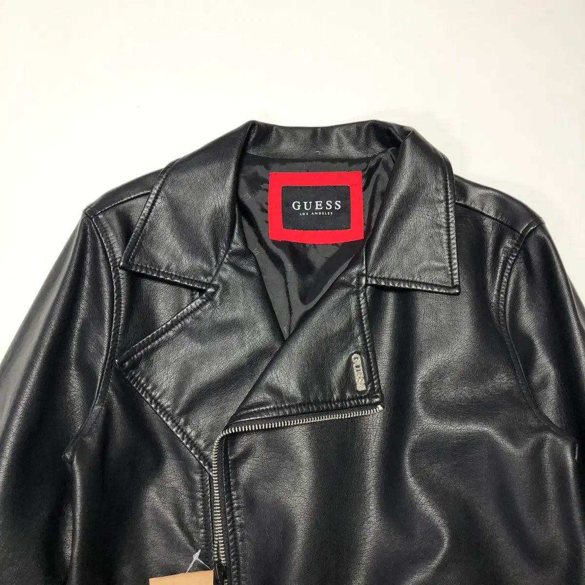 GUESS ライダースジャケット - メルカリ