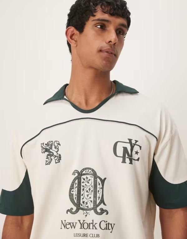 エイソス メンズ トップス ポロシャツ グラフィック ASOS DESIGN boxy oversized polo shirt with cut and sew paneling and city graphics in cream Tofu クリーム