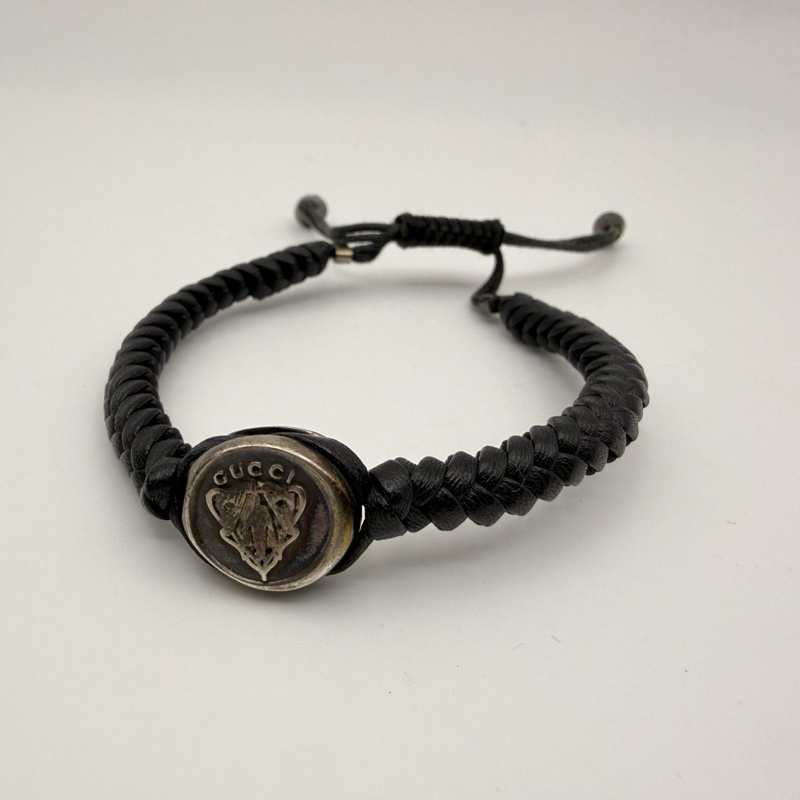 GUCCI（グッチ）クレストエンブレム 編み込みレザーブレスレット Ag925