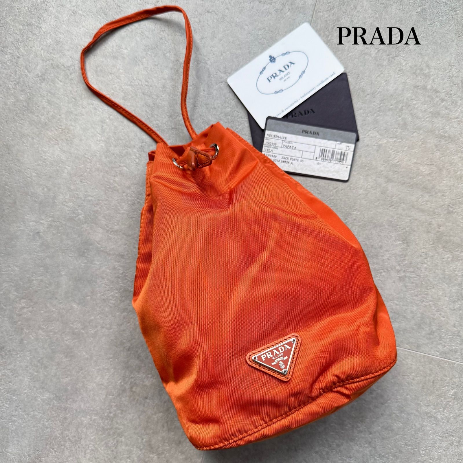 ✨希少✨プラダ 巾着バッグ 三角ロゴプレート レザー×ナイロン オレンジ 美品 PRADA プラダ 三角ロゴプレート ナイロン サフィアーノレザー