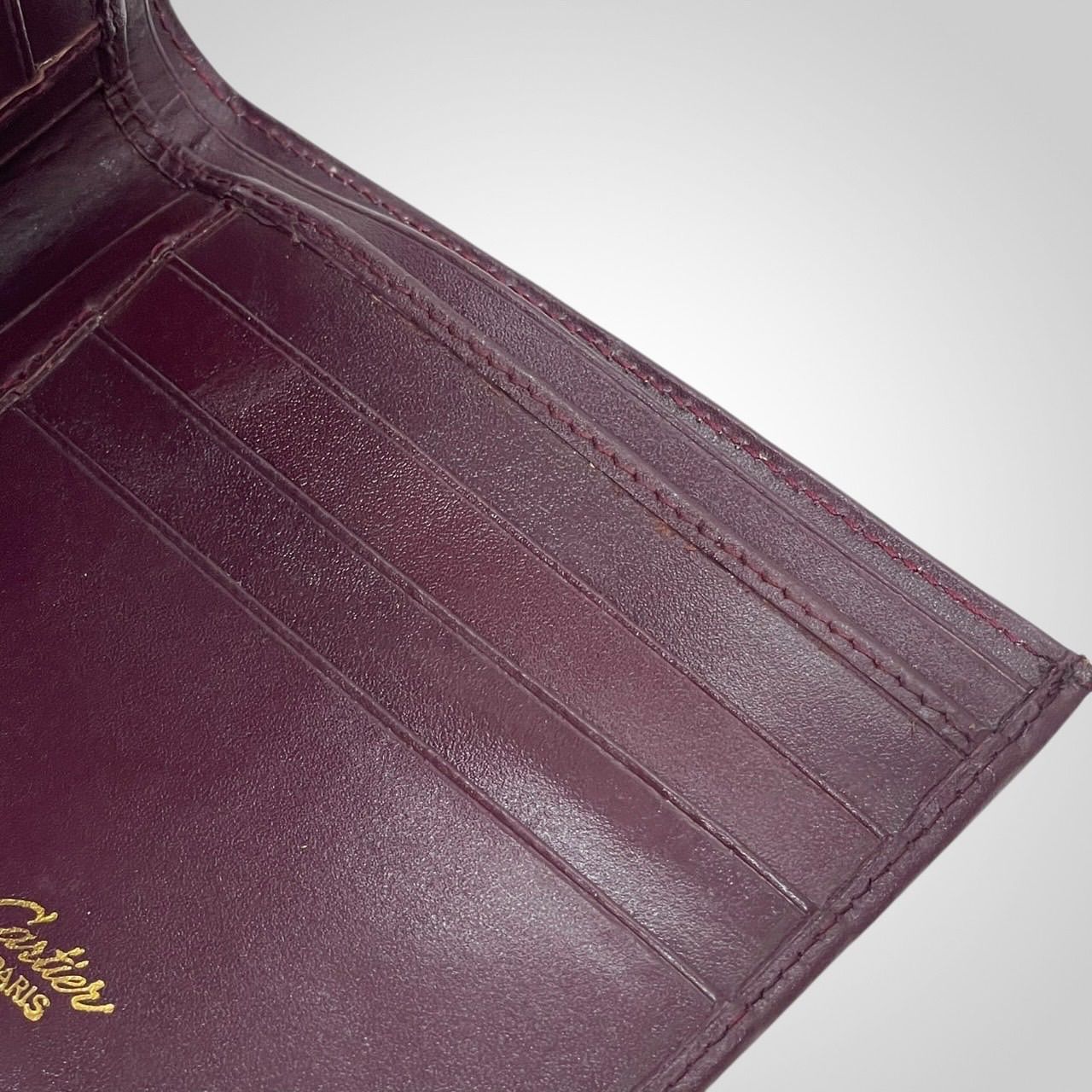 Cartier カルティエ マストライン 二つ折り財布 ボルドー レザー ロゴ