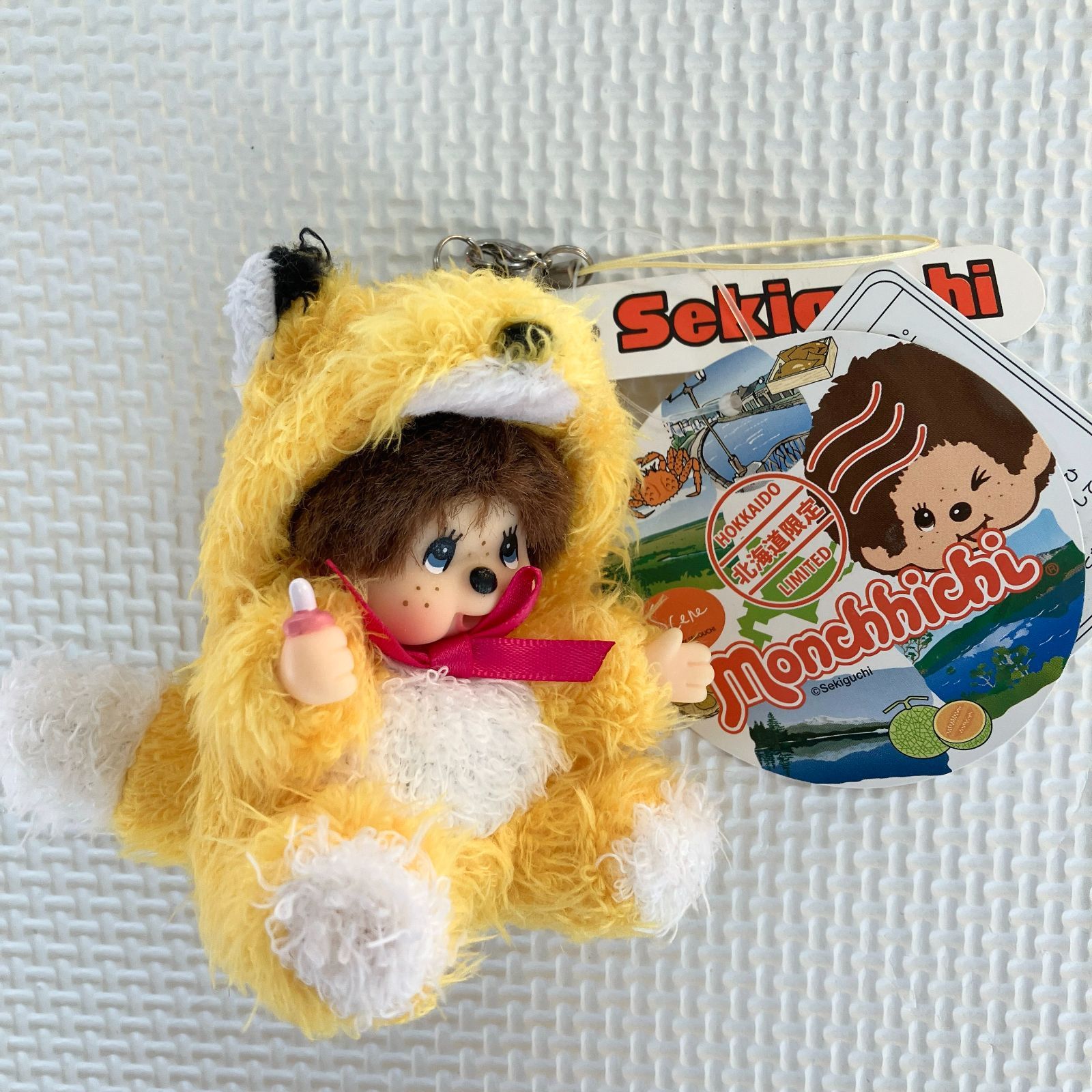 新品] 北海道限定モンチッチ もこもこぬいぐるみマスコットキタキツネ
