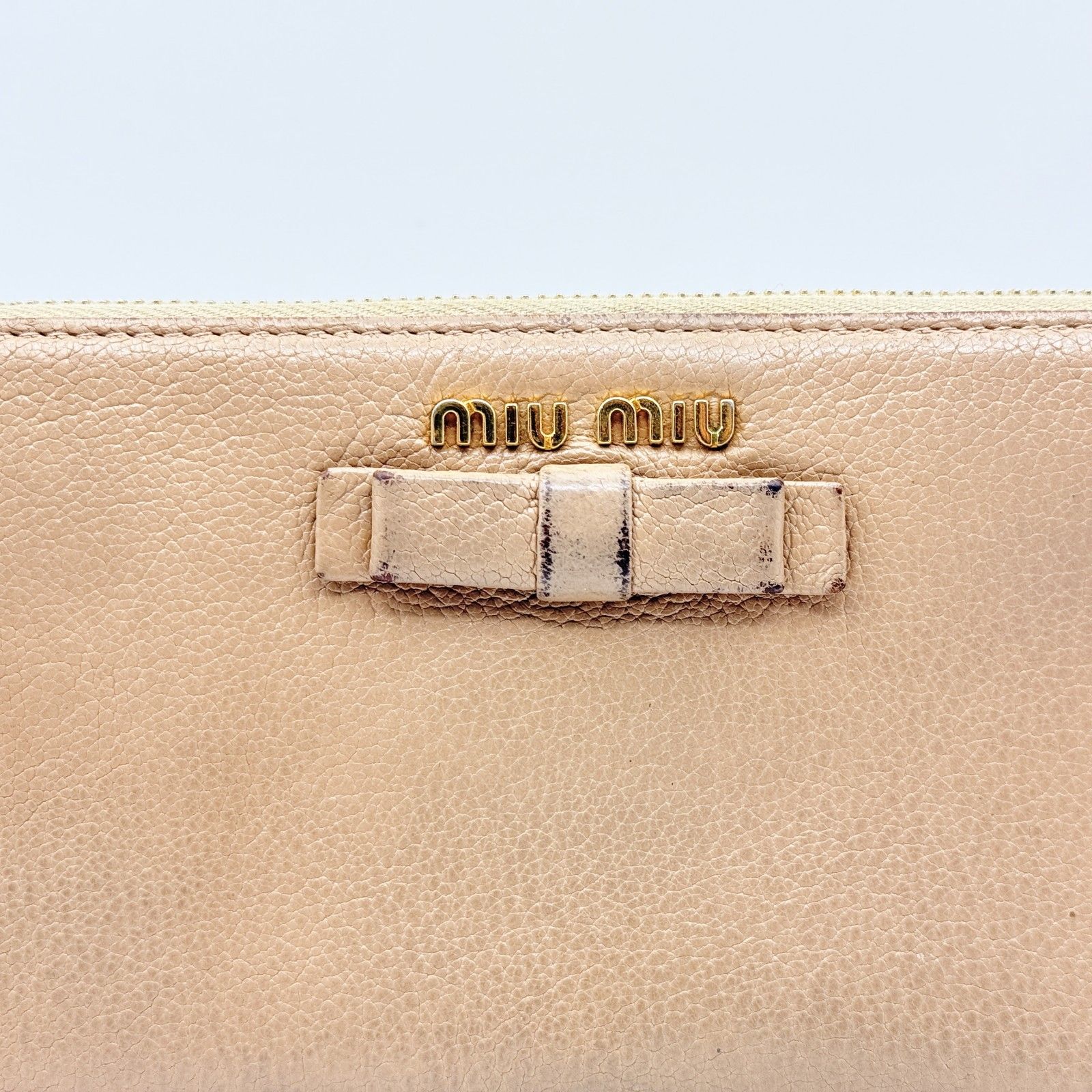 MIU ミュウミュウ 長財布 ラウンドファスナー リボンモチーフ付き ロゴ