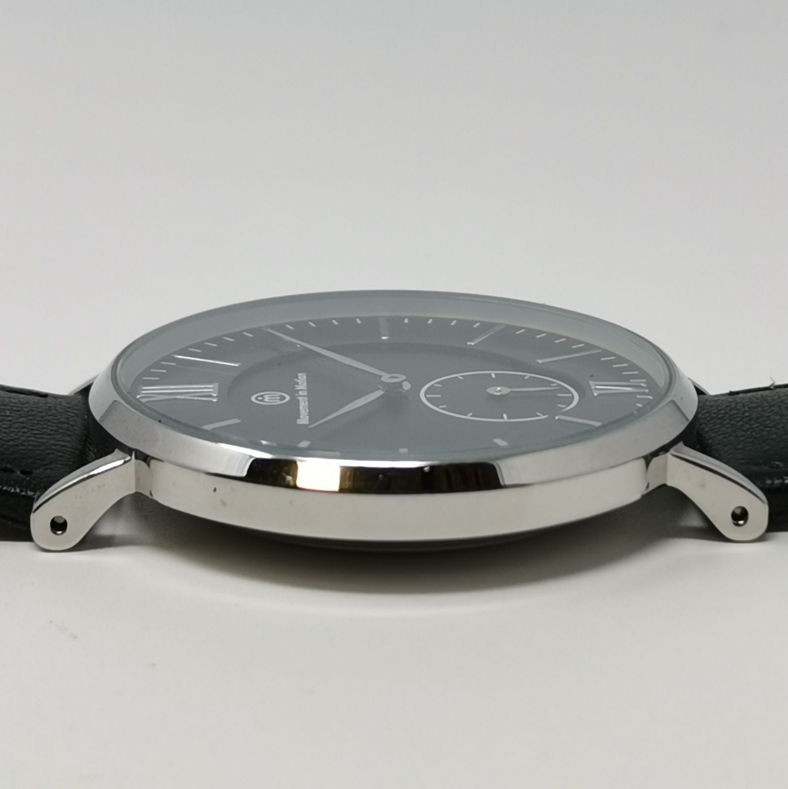 Movement in motion クォーツ メンズ腕時計 文字盤ブラック 電池切れの 