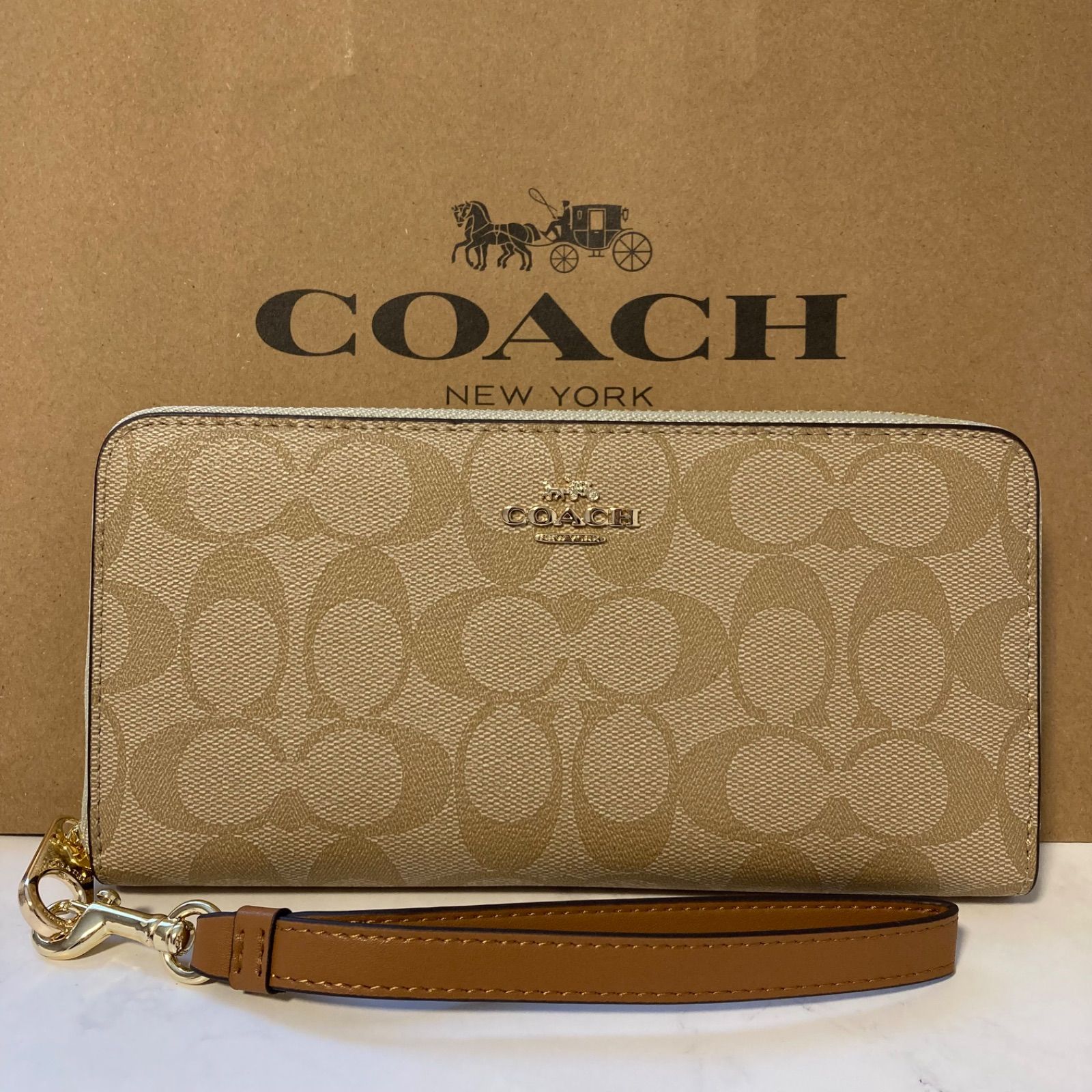 新品 コーチ 長財布 シグネチャー ブラウン ストラップ付き - メルカリ