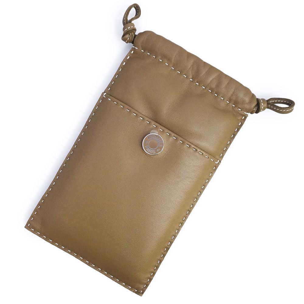 エルメス ピロ フォンケース クルードセル アニューミロ エトゥープ エトープ グレージュ K刻印 携帯 スマホ スマートフォンケース ラムスキン レザー シルバー金具 箱付 HERMES（未使用　展示品）