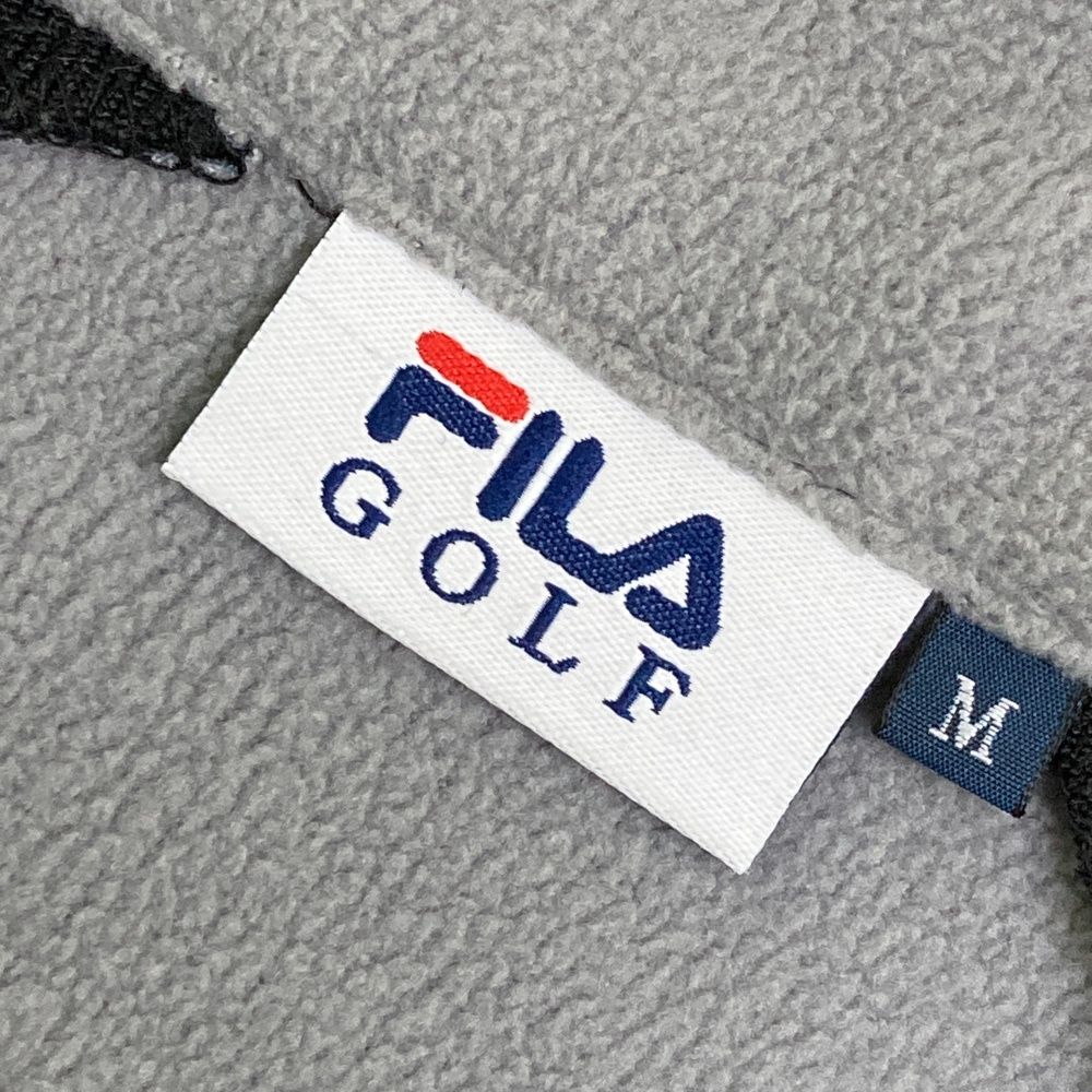 サイズ：M FILA GOLF フィラゴルフ  裏起毛ジップジャケット ドット柄 ブラック系 [240101635301] ゴルフウェア レディース ストスト サイズ：M FILA GOLF フィラゴルフ 裏起毛ジップジャケット ドット柄