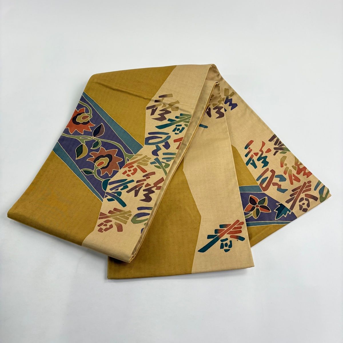 美品】 袋帯 秀品 証紙 大島紬地 春夏秋冬 草花 黄土色 お太鼓柄 正絹