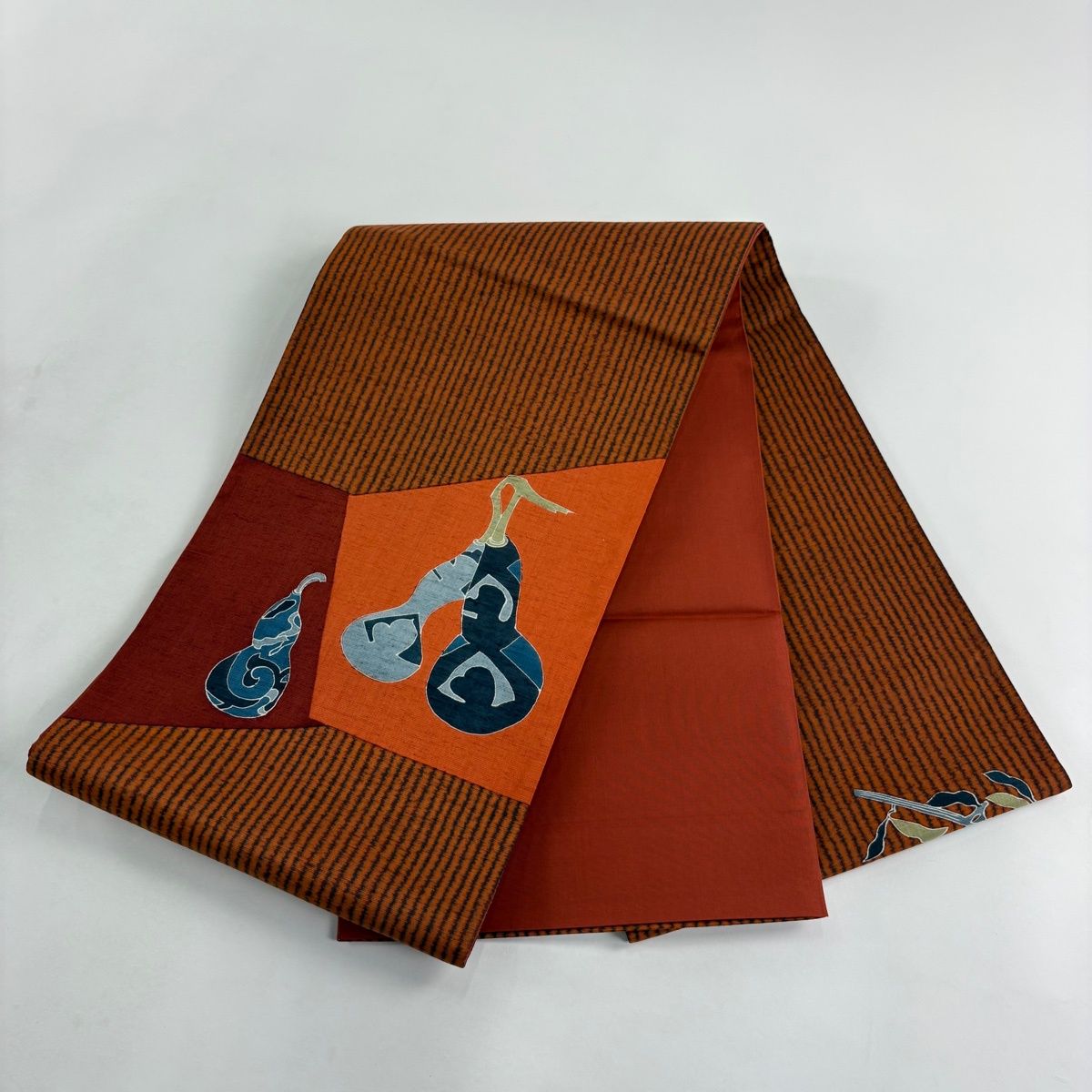 袋帯 秀品 証紙 大島紬地 瓢箪 縞 オレンジ お太鼓柄 正絹 【中古